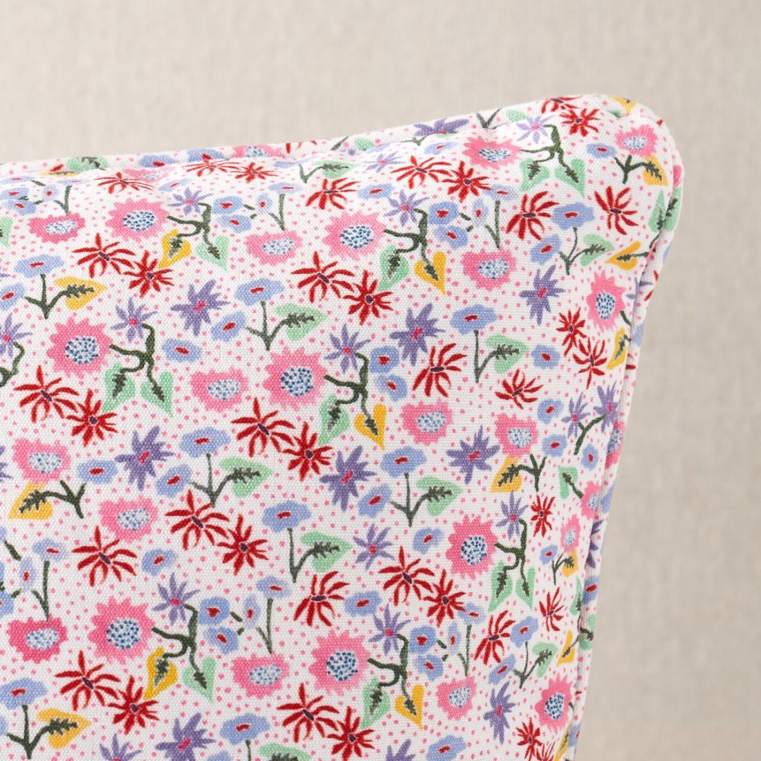 This pillow features Calico by Happy Menocal for Schumacher with a self-welt finish. Happy Menocal’s multicolor microfloral fabric offers a fresh take on a traditional calico. With its charming, stylized flowers scattered against a stippled