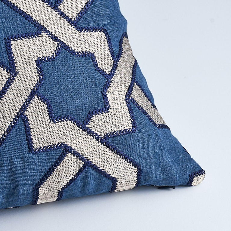 This pillow features Cordoba Embroidery with a knife edge finish. This sumptuous embroidery was inspired by Moorish tiles. Subtle variations are part of its inherent beauty. Pillow includes a feather/down fill insert and hidden zipper closure. 