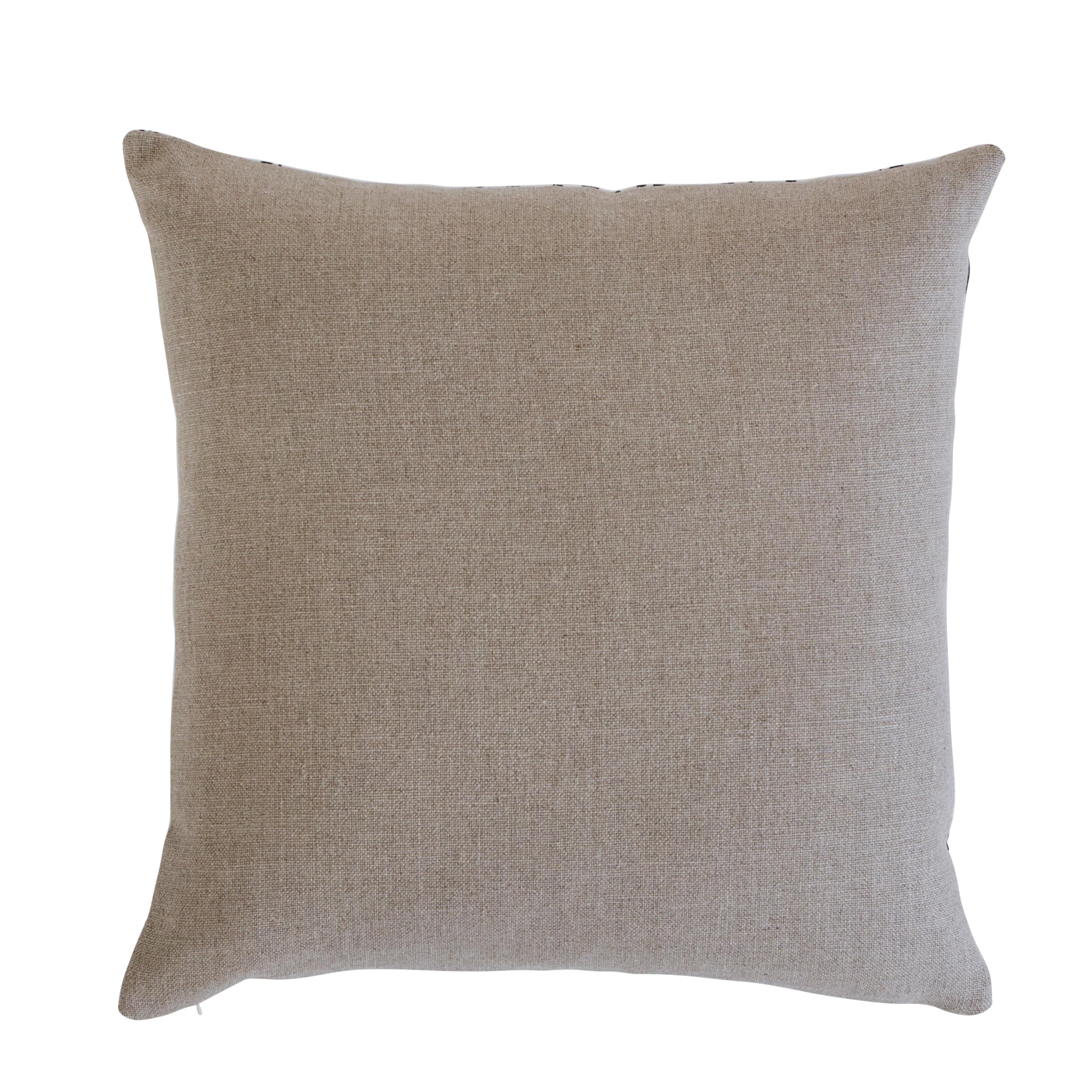 This pillow features Cynthia Embroidered Print with a knife edge finish. A hand printed botanical with hand embroidered details, this understated design features artful blossoms on a muslin-like ground. Back of pillow features Piet Performance