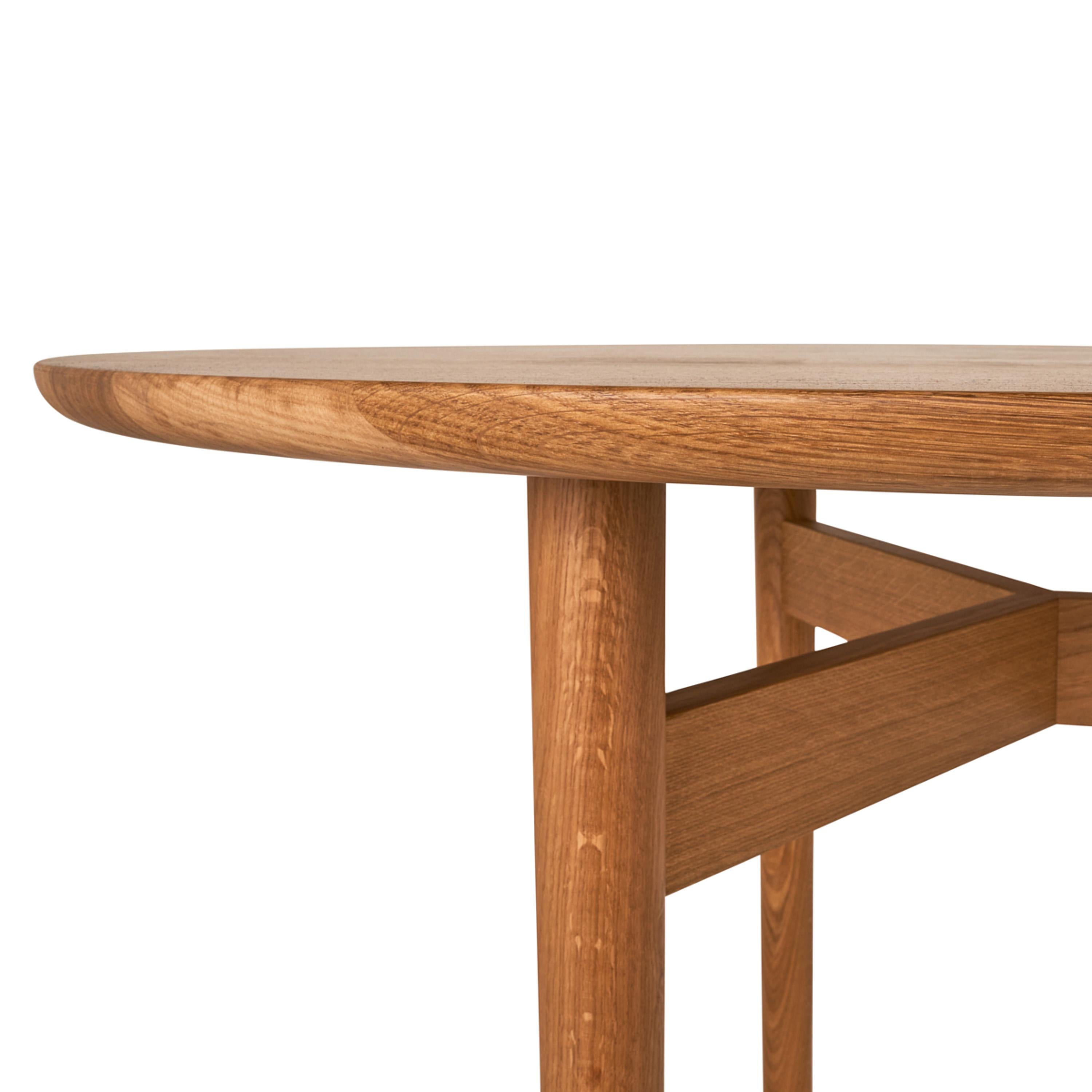 Elegantly beveled to give the solid oak construction a pure and light appearance, the Puffin Dining Table’s elliptical top is the perfect marriage of form and function. Designed in Denmark by Charlotte Høncke and meticulously handcrafted in Italy,