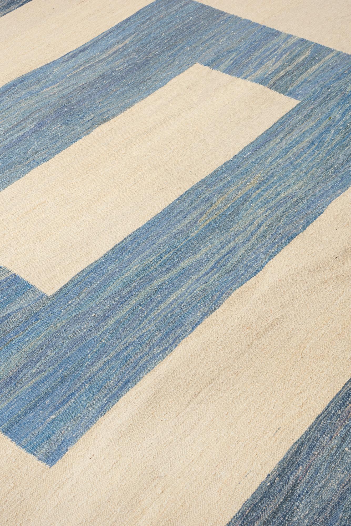 Rugs and floor coverings
Rug pattern: Kilim
Dimensions: 10' x 14'
Fiber content: Wool
Construction: Handwoven
Colorway: Blue

Handmade rugs are subject to size variations of up to 3%. Due to variations in dye lots, actual colors are not