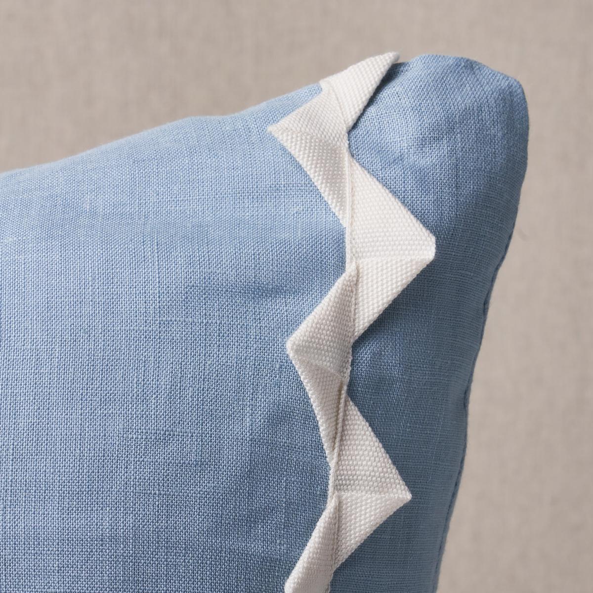 This pillow features Lazare with a knife edge finish. Grosgrain ribbon is folded into zigzag bands and sewn onto a linen-blend ground fabric to create Lazare in ivory-on-chambray, a unique three-dimensional stripe. Pillow includes a feather/down