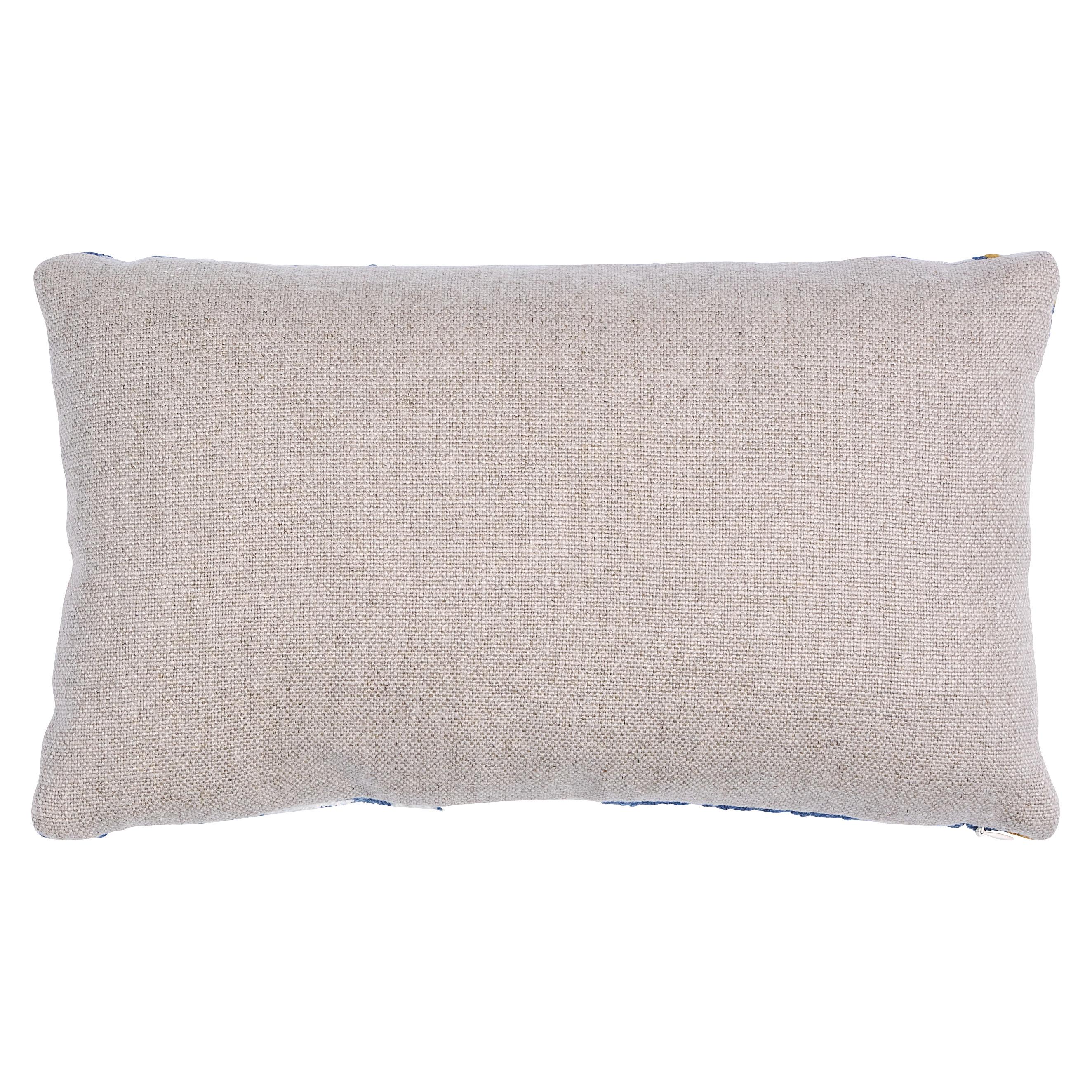 This pillow features Marguerite Embroidery with a knife edge finish. Happy and humble, Marguerite Embroidery features a hand-stitched floral design on a linen ground. Subtle irregularities in the wool yarns create dimension and quaint charm. Pillow