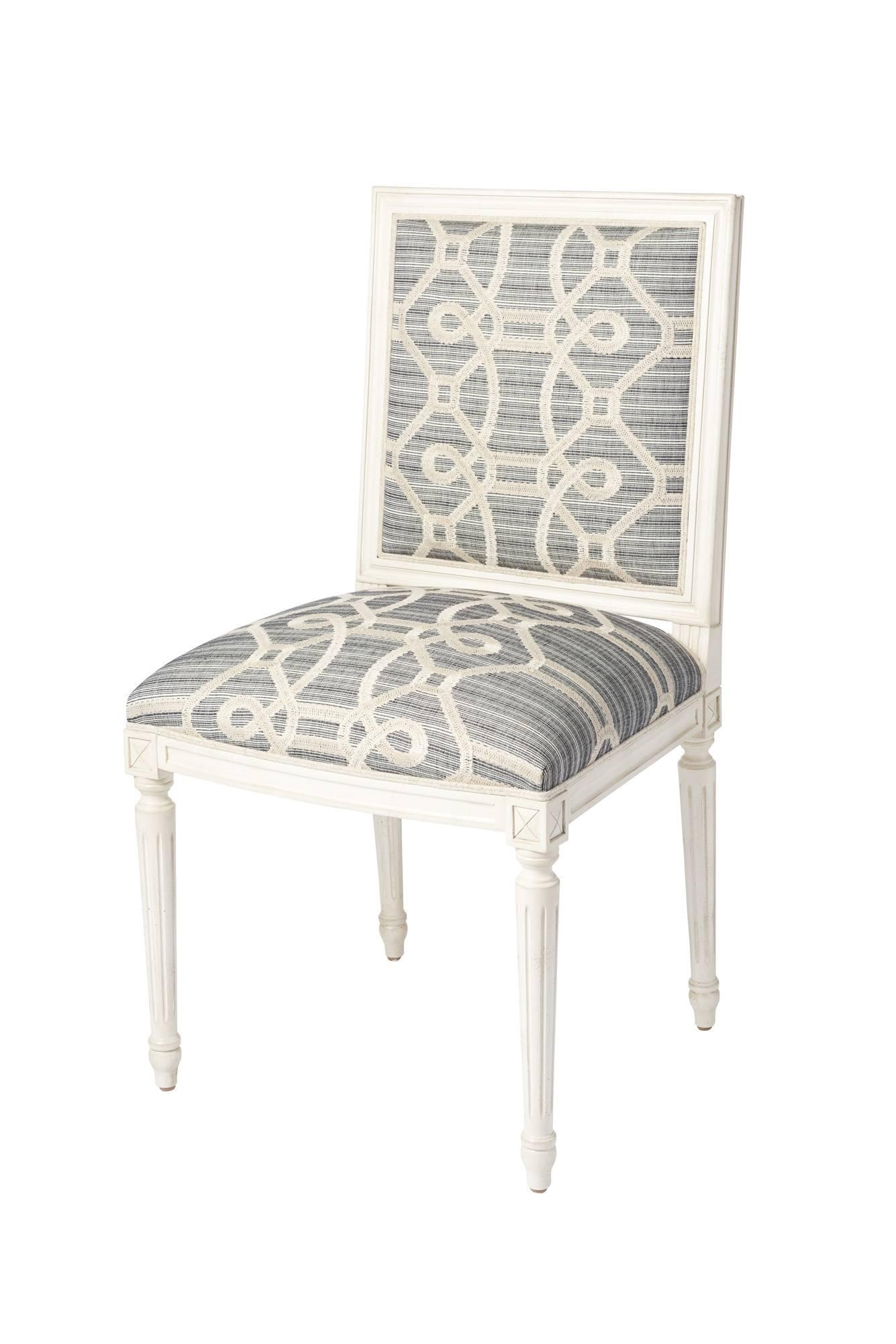 The Marie Therese side chair is a classic, timeless silhouette that features a hand-carved European beechwood frame. This chair is upholstered in Schumacher Ziz Embroidery. With an intentionally irregular strié ground and a fanciful updated trellis