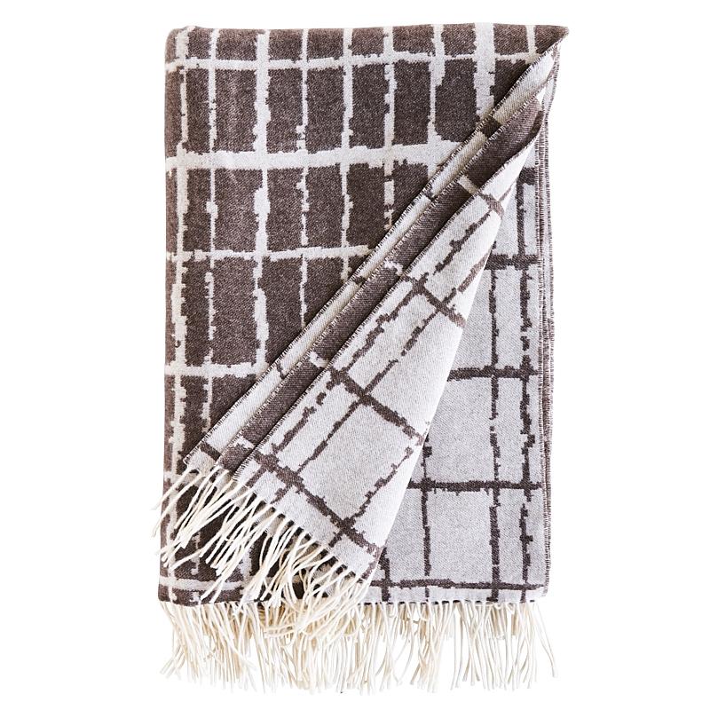 The jaunty, irregular check of our Plaid Throw is subtle and sophisticated and lets the luxury of the fibers shine. Made from the softest Italian cashmere and merino wool, this reversible throw is cloudlike and cosseting and finished with a fringe.