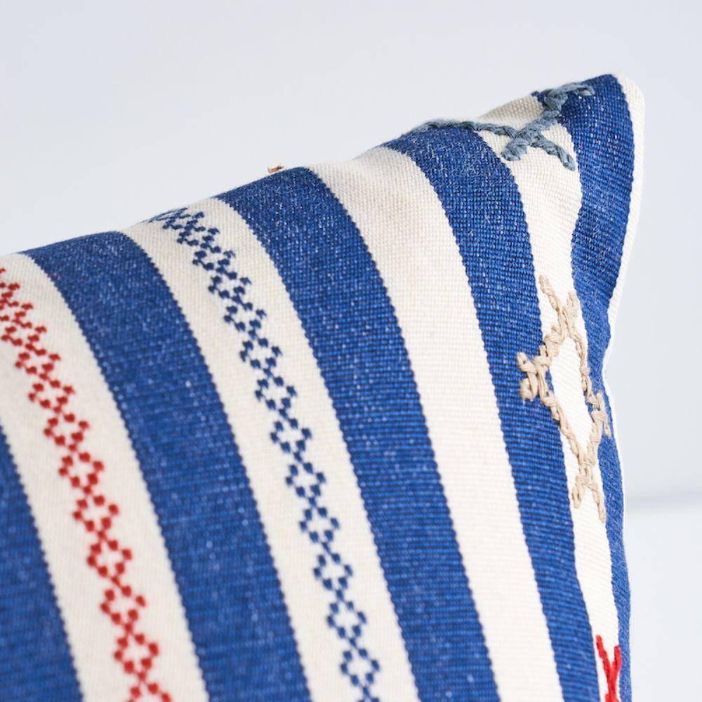 This pillow features Rhodes Stripe with a¬†knife edge finish. Inspired by Ukrainian needlework, Rhodes Stripe is a woven stripe overlaid with charming cross-stitched flourishes that take it from ordinary to extraordinary. Pillow includes a