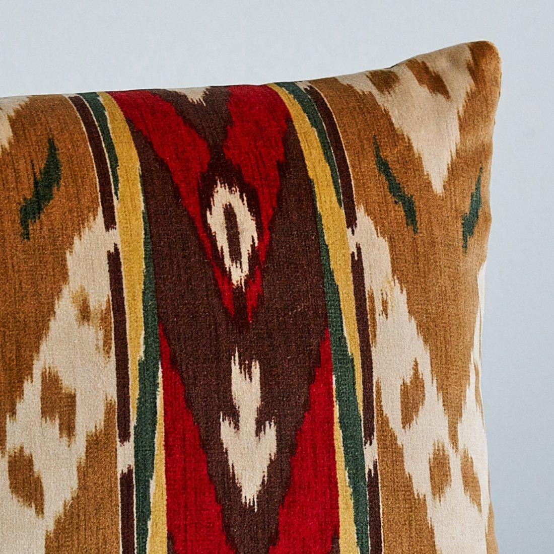 This pillow features Samar Ikat Velvet with a knife edge finish. Based on an antique woven silk, this lush cotton velvet was reinterpreted as a stripe and printed, allowing for a larger range of color and scale. Pillow includes a feather/down fill