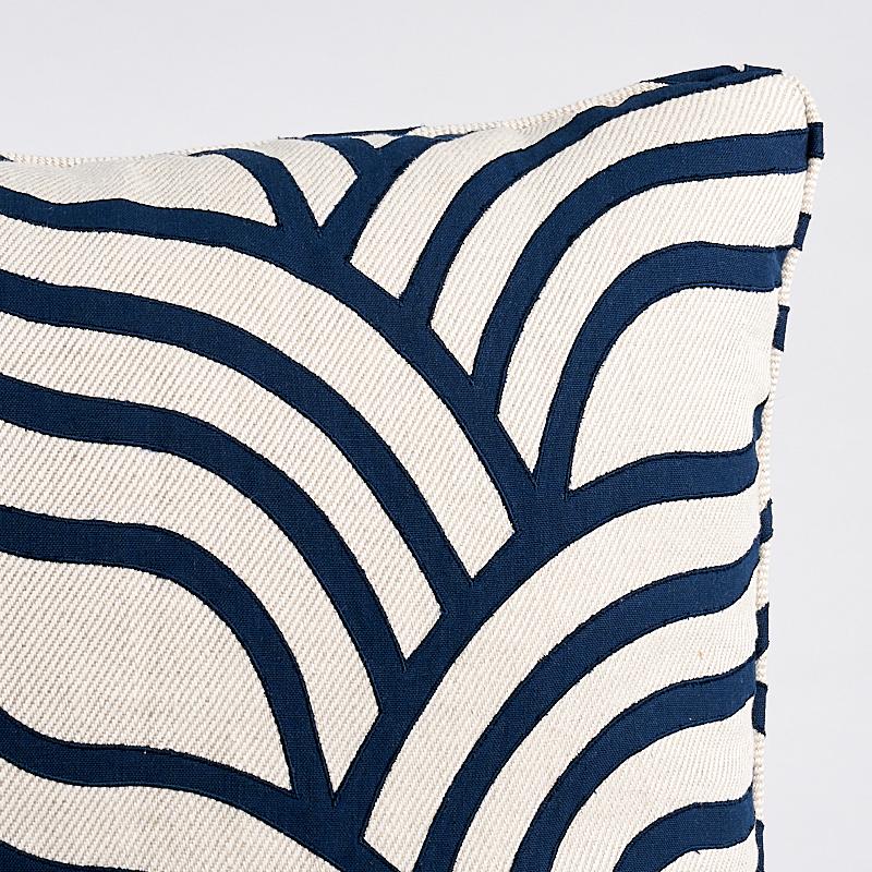 This pillow features Sangomar Applique with a self welt finish. Curvaceous, undulating lines of appliqu√© create a striking contrast with a chunky, solid twill ground for a laid-back look that still has a lot of drama. Pillow includes a feather/down