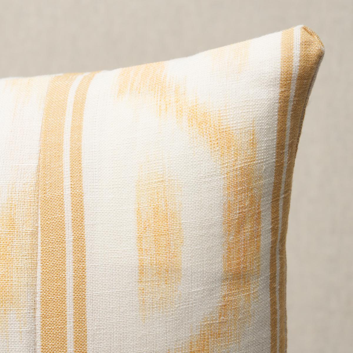This pillow features Santa Monica Ikat by Mark D. Sikes for Schumacher with a knife edge finish. This artisanally crafted pattern in yellow puts a fresh spin on an archival ikat. Pillow includes a feather/down fill insert and hidden zipper
