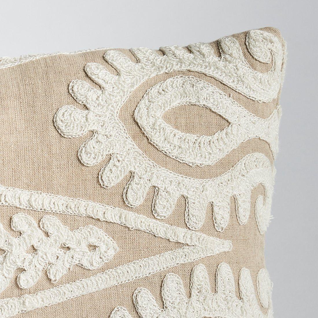 This pillow features Seema Embroidery with a Knife Edge finish. Embroidered with a rustic chain stitch on a linen ground, this ivory-on-white Seema Embroidery has an Ottoman feeling that’s stylish but laidback. With a large repeat that runs the