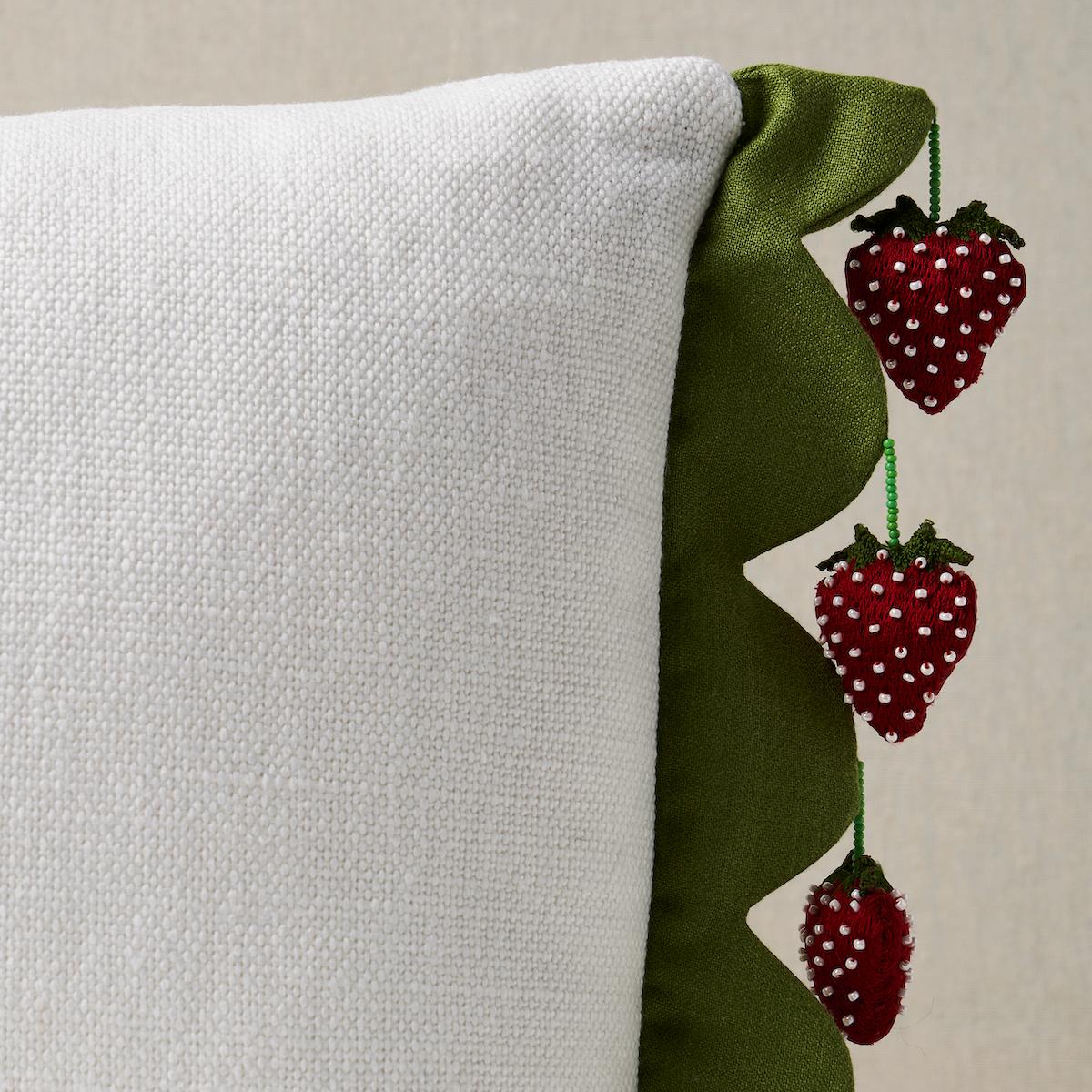 This pillow features Strawberry Jam Trim by Johnson Hartig for Schumacher with a knife edge finish on top and bottom. Strawberry Jam Trim in green is a whimsical handmade design created in collaboration with Johnson Hartig. Body of pillow is Piet