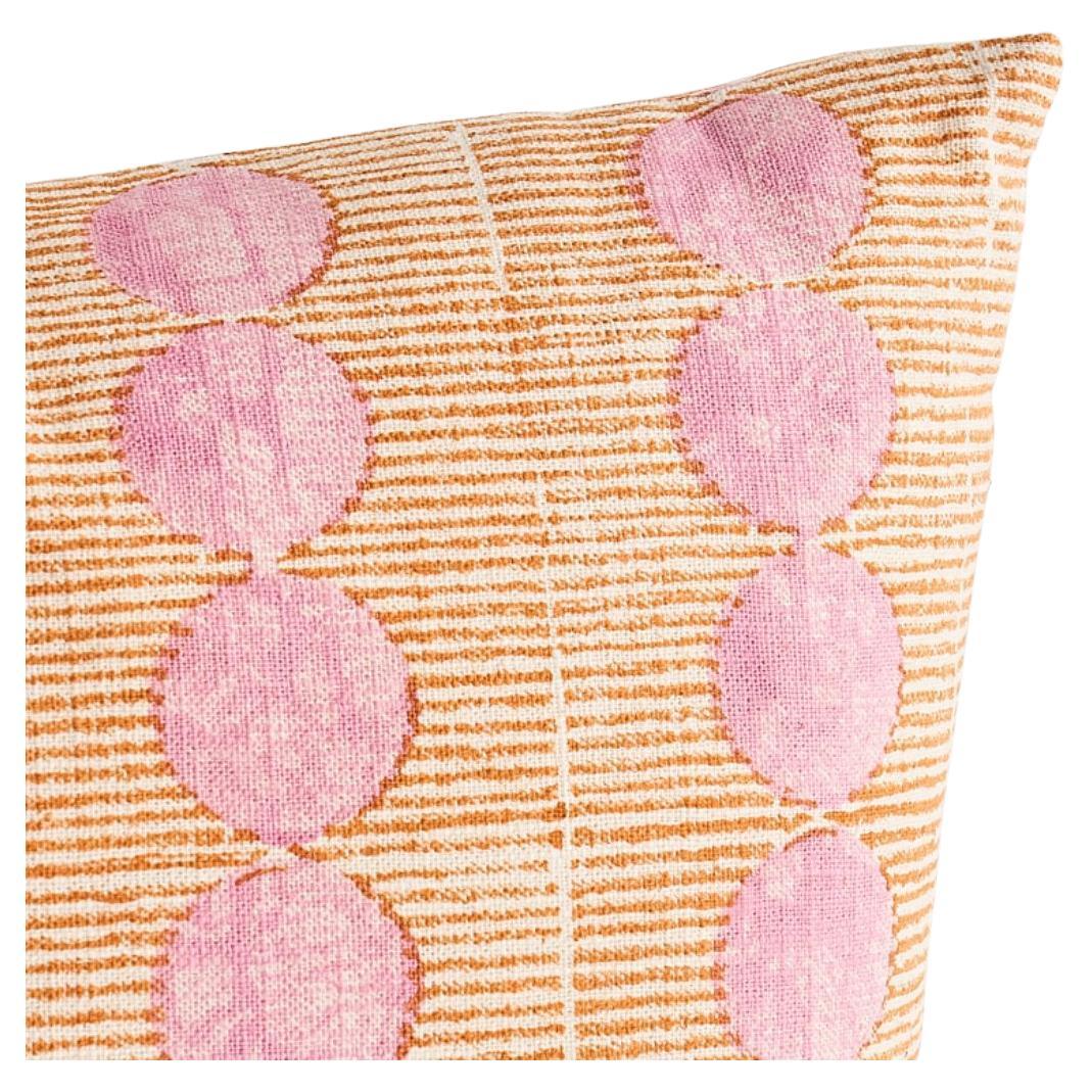 This pillow features Sun Rise Hand Block with a knife edge finish. A linen, rose-and-copper fabric with a simplified pattern of repeating lines and orbs, Sun Rise celebrates a new dawn and the rhythm of nature. Pillow includes a feather/down fill
