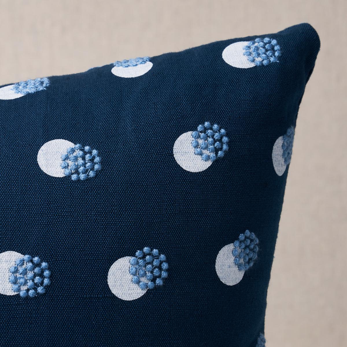 This pillow features Taylor Embroidery with a knife edge finish. Taylor Embroidery in blue-on-ivory artfully combines a few simple elements—bursts of offset French knots embroidered over a field of hand-screened dots—for a linen fabric that’s