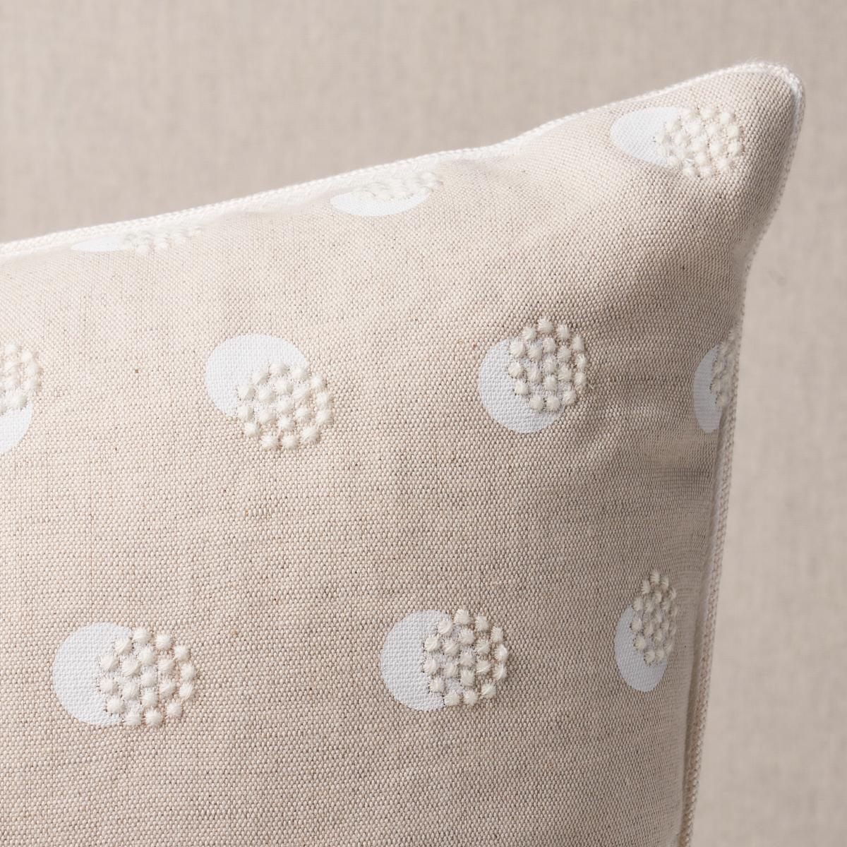 This pillow features Taylor Embroidery with a knife edge finish. Taylor Embroidery in ivory-on-natural artfully combines a few simple elements—bursts of offset French knots embroidered over a field of hand-screened dots—for a linen fabric that’s