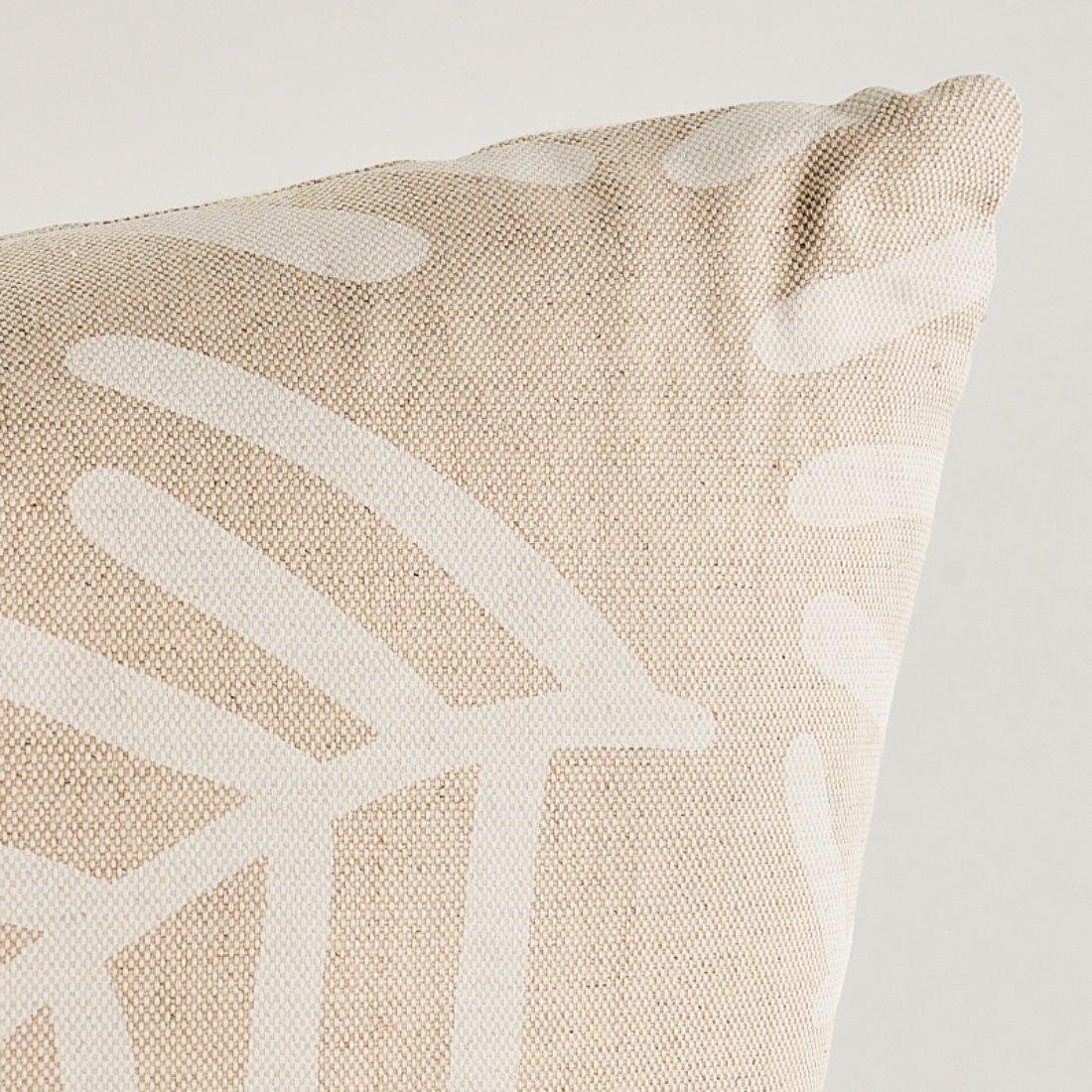 This pillow features Tiah Cover by Caroline Hurley for Schumacher with a knife edge finish. Tiah Cove was designed by artist Caroline Z Hurley in her Brooklyn studio. Both organic and graphic, this ivory-on-natural profusion of lanky abstract ferns