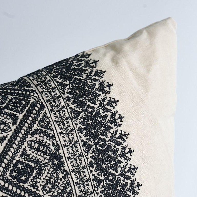 This pillow features Toledo with a knife edge finish. A gorgeously boho fabric with a relaxed cotton-linen ground that plays beautifully against the intensely detailed yet delicate embroidered bands. Pillow includes a feather/down fill insert and