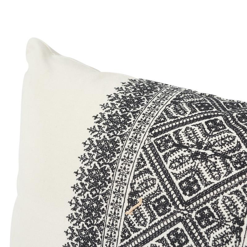 This pillow features Toledo with a knife edge finish. A gorgeously boho fabric with a relaxed cotton-linen ground that plays beautifully against the intensely detailed yet delicate embroidered bands. Pillow includes a feather/down fill insert and