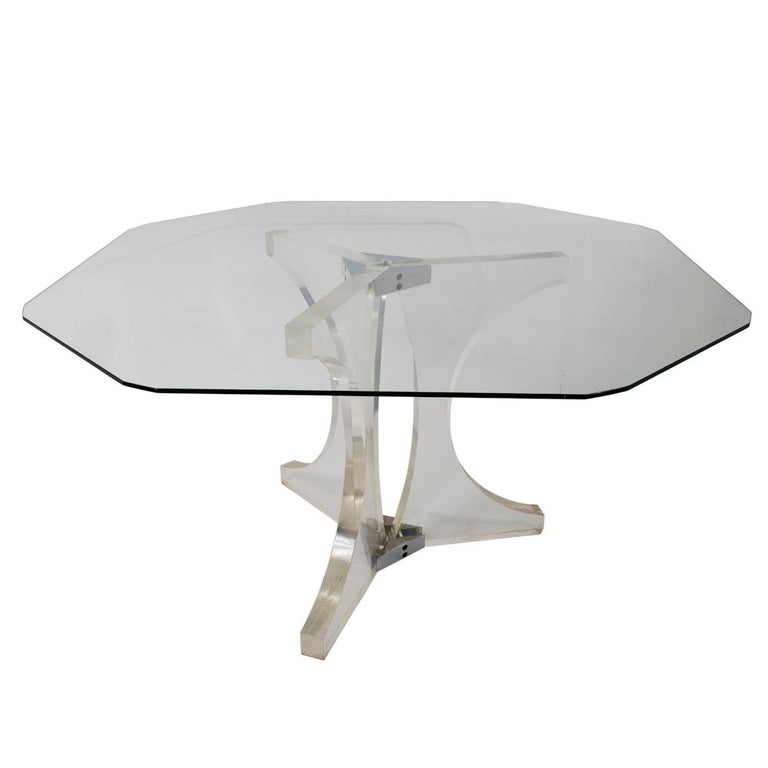 This plexiglass table is clearly 1970s fabulous. Sculptural in form, the appeal of the striking tripod base is immediately apparent and can be viewed from every angle—including through the octagonal top. Some small scratches and a small crack at the
