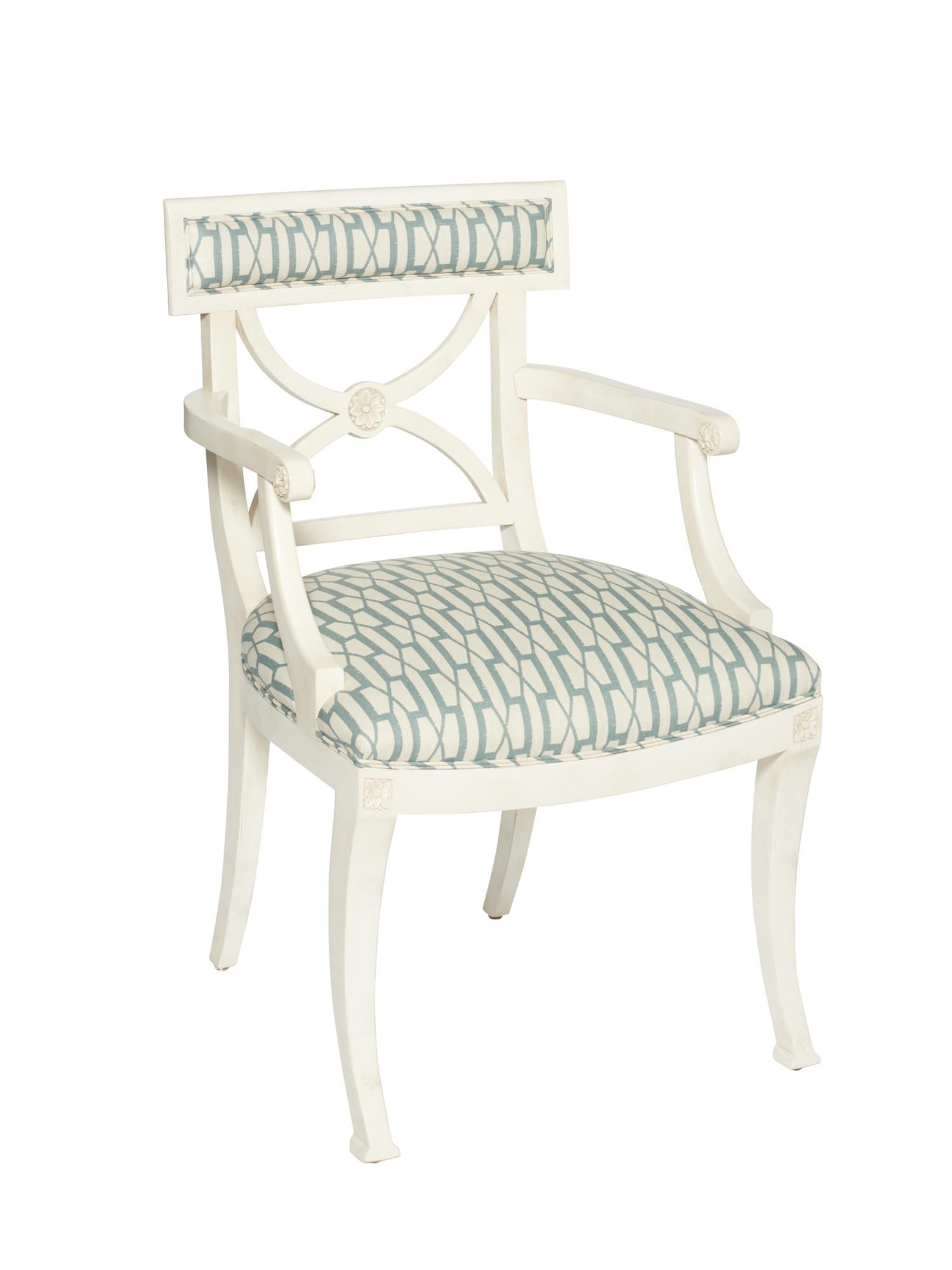 The Westminster chair is a timeless and stylish silhouette that features hand-carved European beechwood frame with floral accents. This frame is upholstered in Schumacher's Belvedere fabric, displaying an updated trellis pattern that's handsome yet