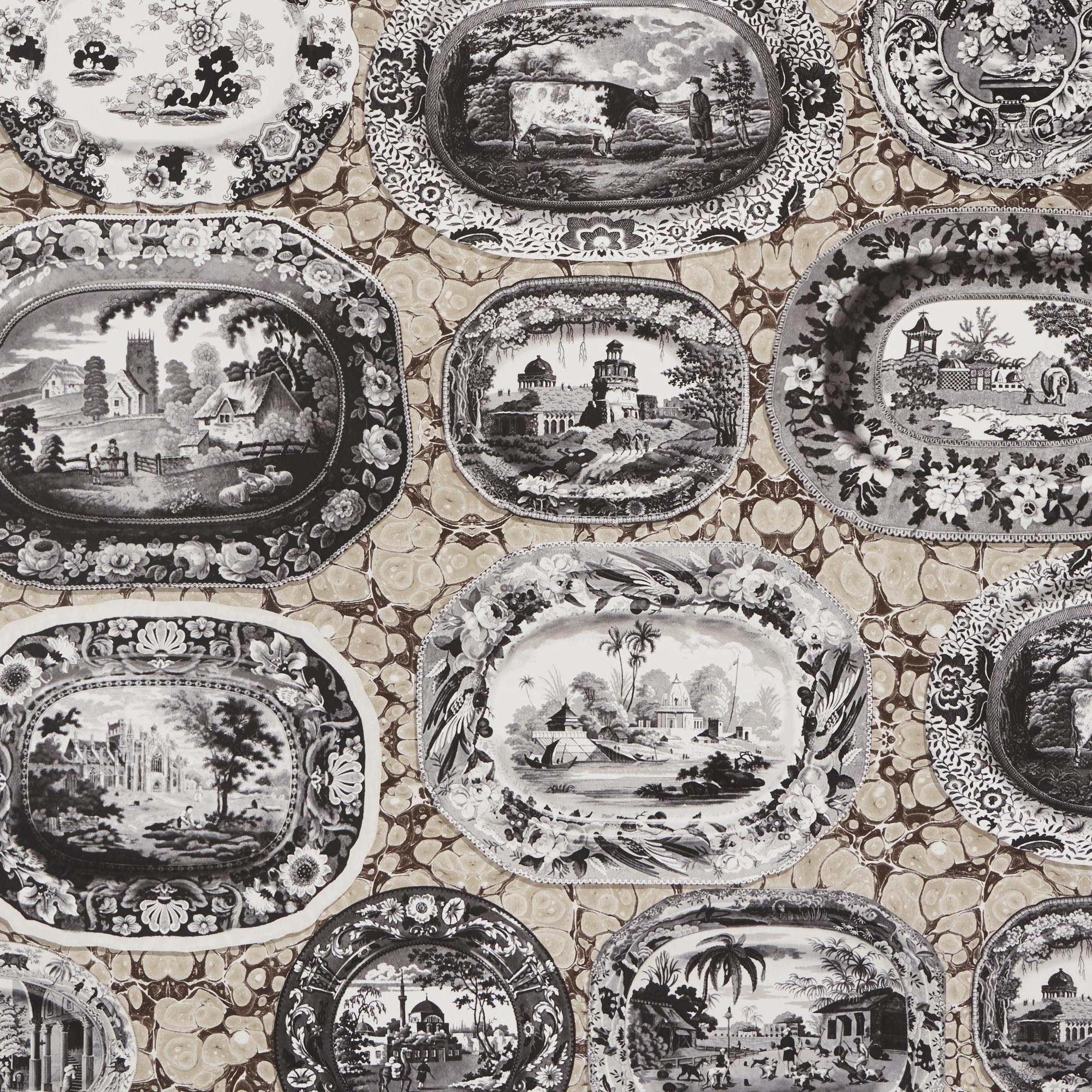 A trompe l’oeil pattern of transferware serving dishes mounted on a marbleized backdrop creates the ultimate layered illusion and instant drama, no hammers or nails required.

Since Schumacher was founded in 1889, our family-owned company has been
