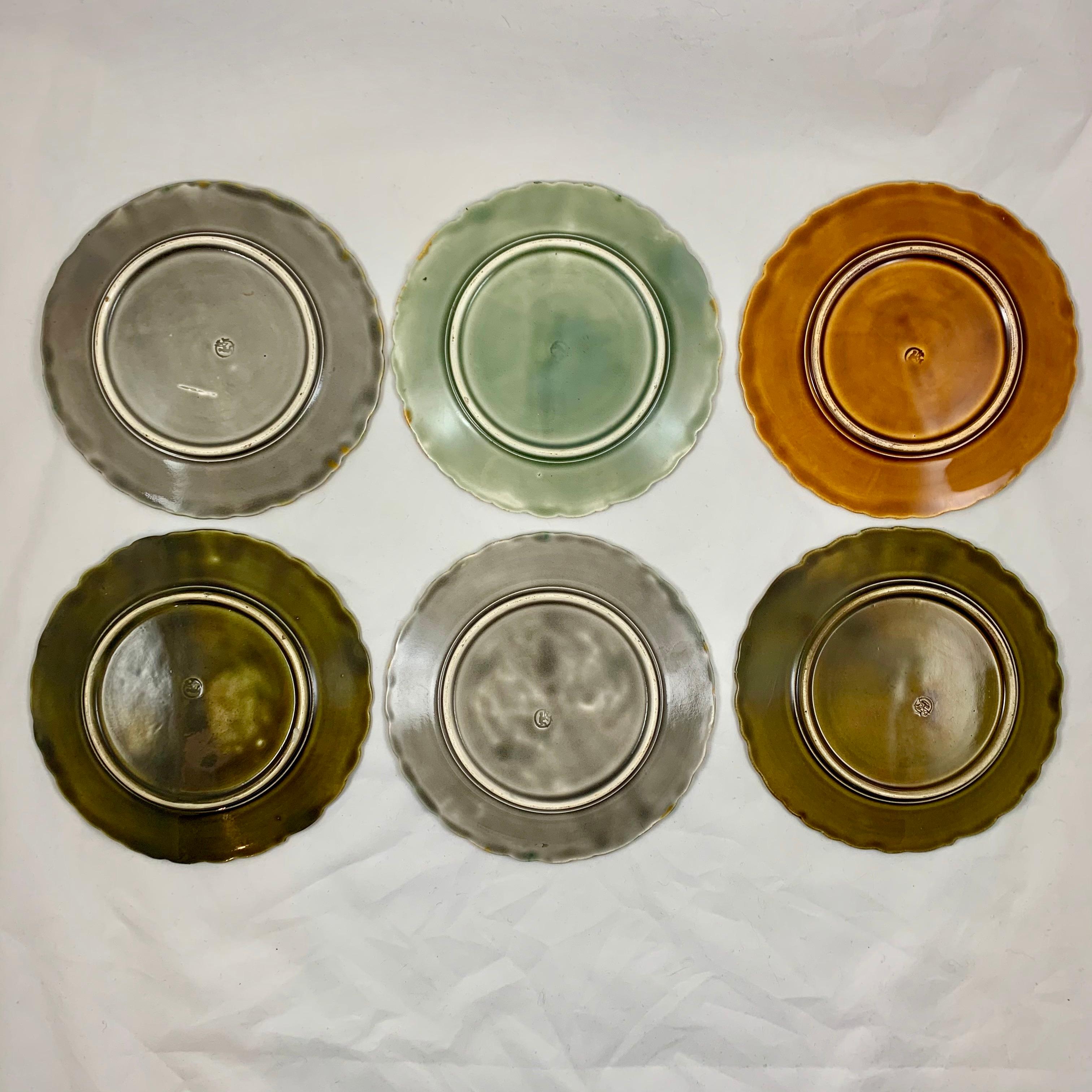 In the Art Nouveau style, a scarce, complete set of six Schütz Brothers dessert plates designed by Josef Steidl Znaim, circa 1890.

Each Majolica glazed plate shows a different colored, large moth drinking nectar from a sunflower blossom, against