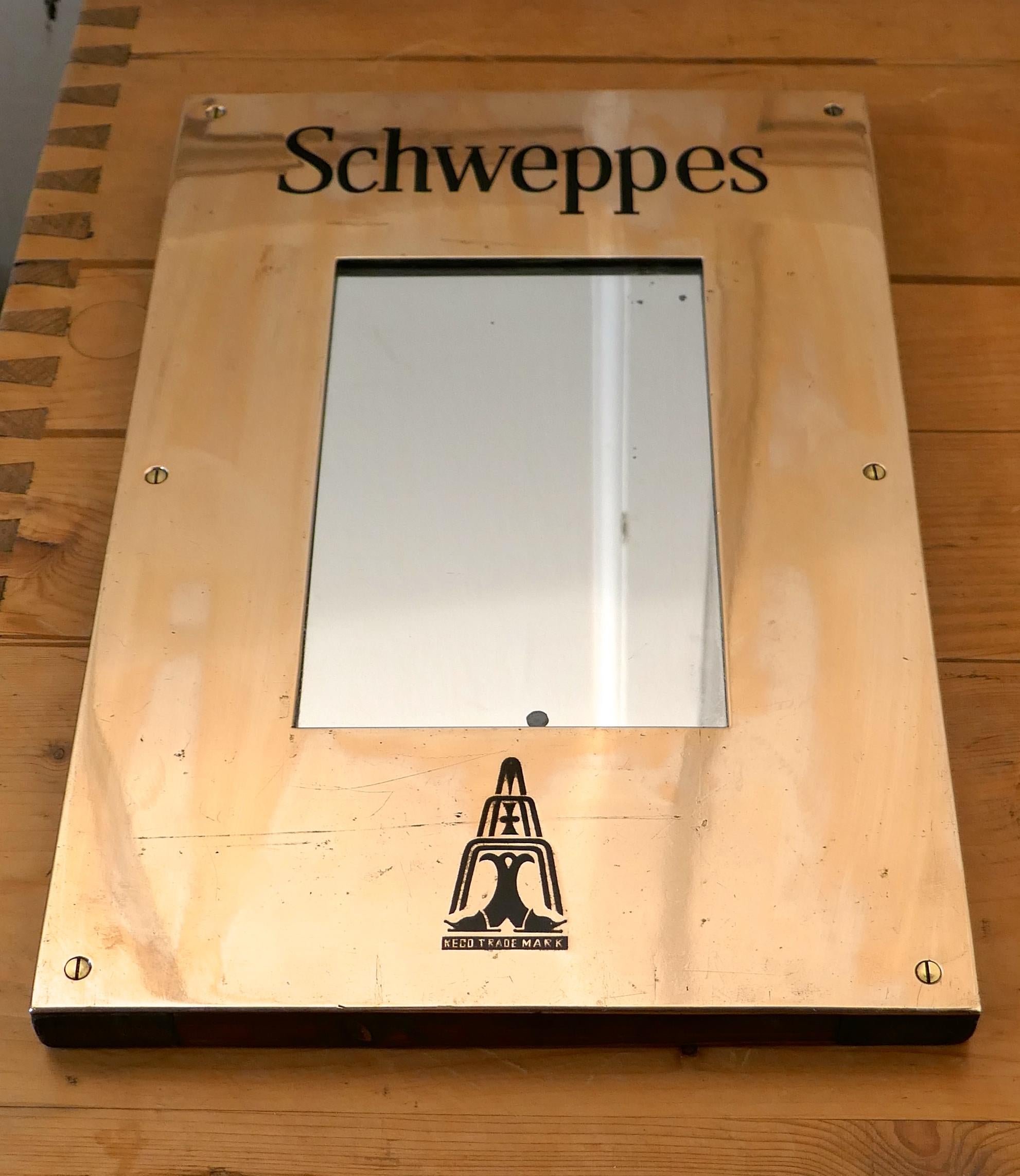 Schweppes brass hotel menu board mirror

An attractive piece of history, this charming brass menu board mirror this would have been hung on the wall at the entrance to the hotel or bar, it has a The Schweppes Logo at the bottom
The brass frame is