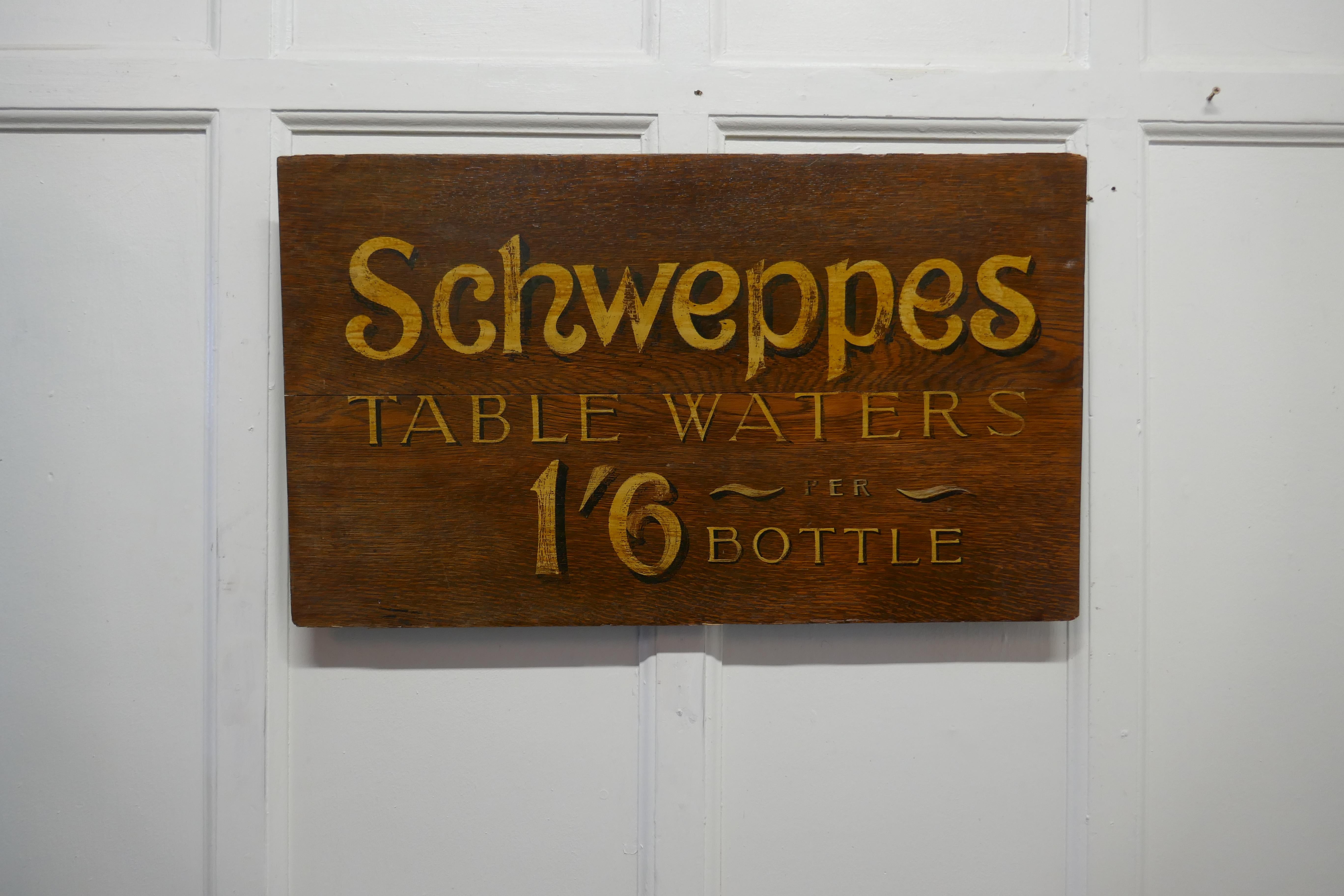 Schweppes table waters oak trade sign board 

This charming Oak Trade Sign would have been hung on the wall at the entrance to a hotel or bar, it has gold Shadow Writing announcing the price of Schweppes Table Waters as 1 shilling and six pence