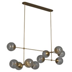 Schwung Armstrong Linear Modern Brass and Glass Linear Chandelier