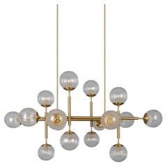 Schwung Riegel Modern Brass and Glass Linear Chandelier