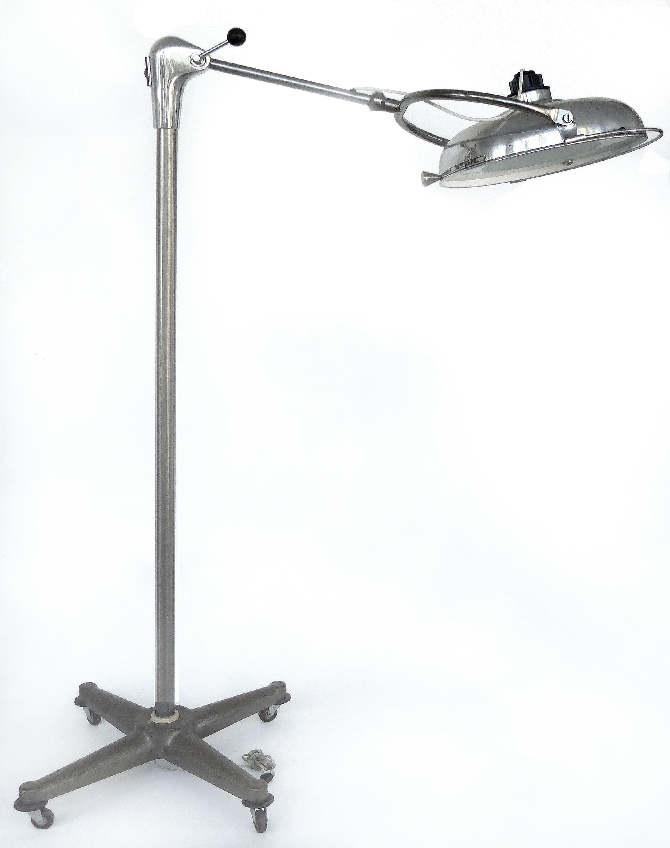 Scialytique French Industrial Surgical Floor Lamp with Pivoting Adjustable Arm

Offered for sale is a French industrial surgical light with a pivoting and adjustable arm. The floor lamp is made of aluminum, iron and glass. The arm has a lever which