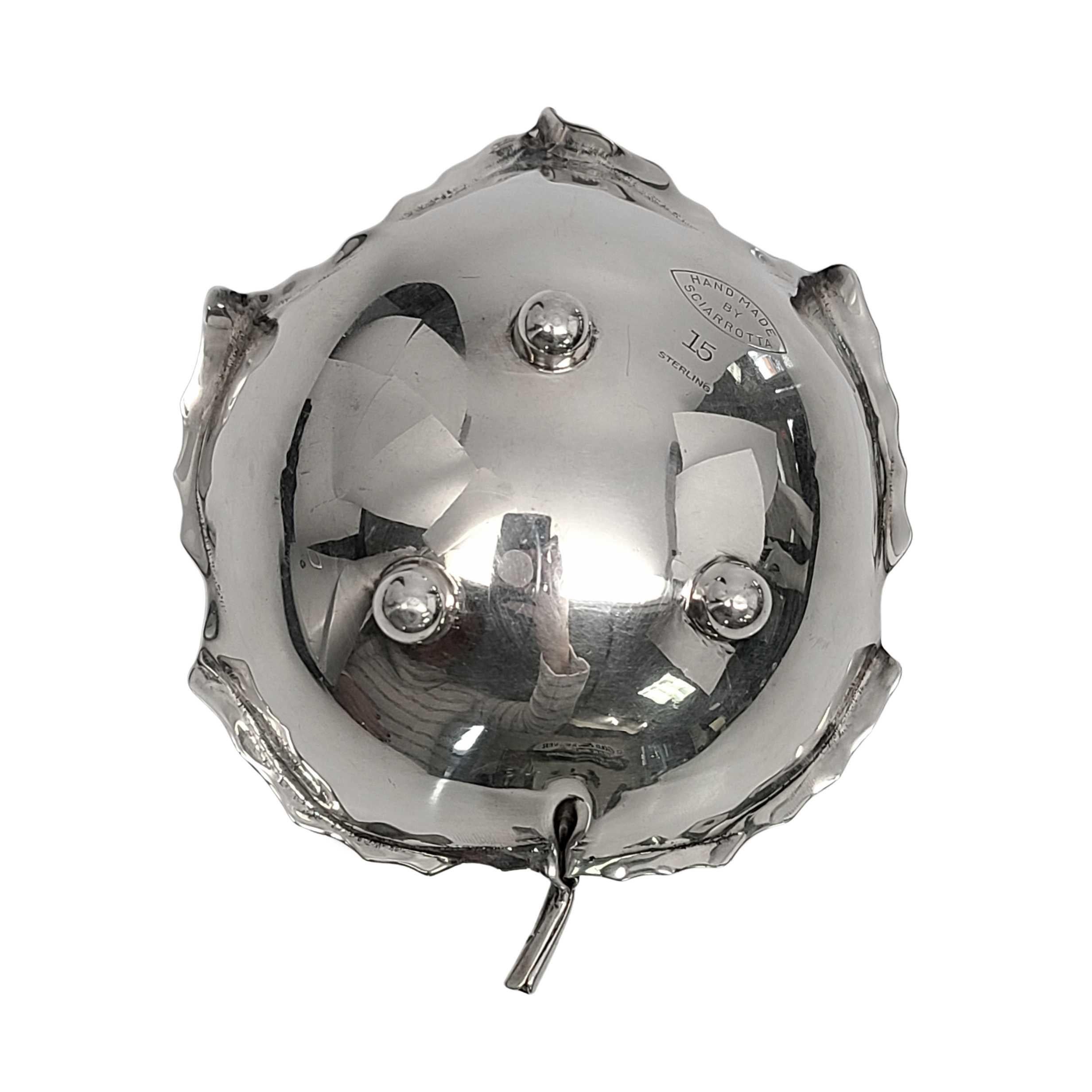 Vintage sterling silver maple leaf bowl by Alfredo Sciarrotta.

Alfredo Sciarrotta, known for high quality and superior craftsmanship, retailed his pieces at many high-end retailers in the mid-20th century. This piece is his iconic leaf design,
