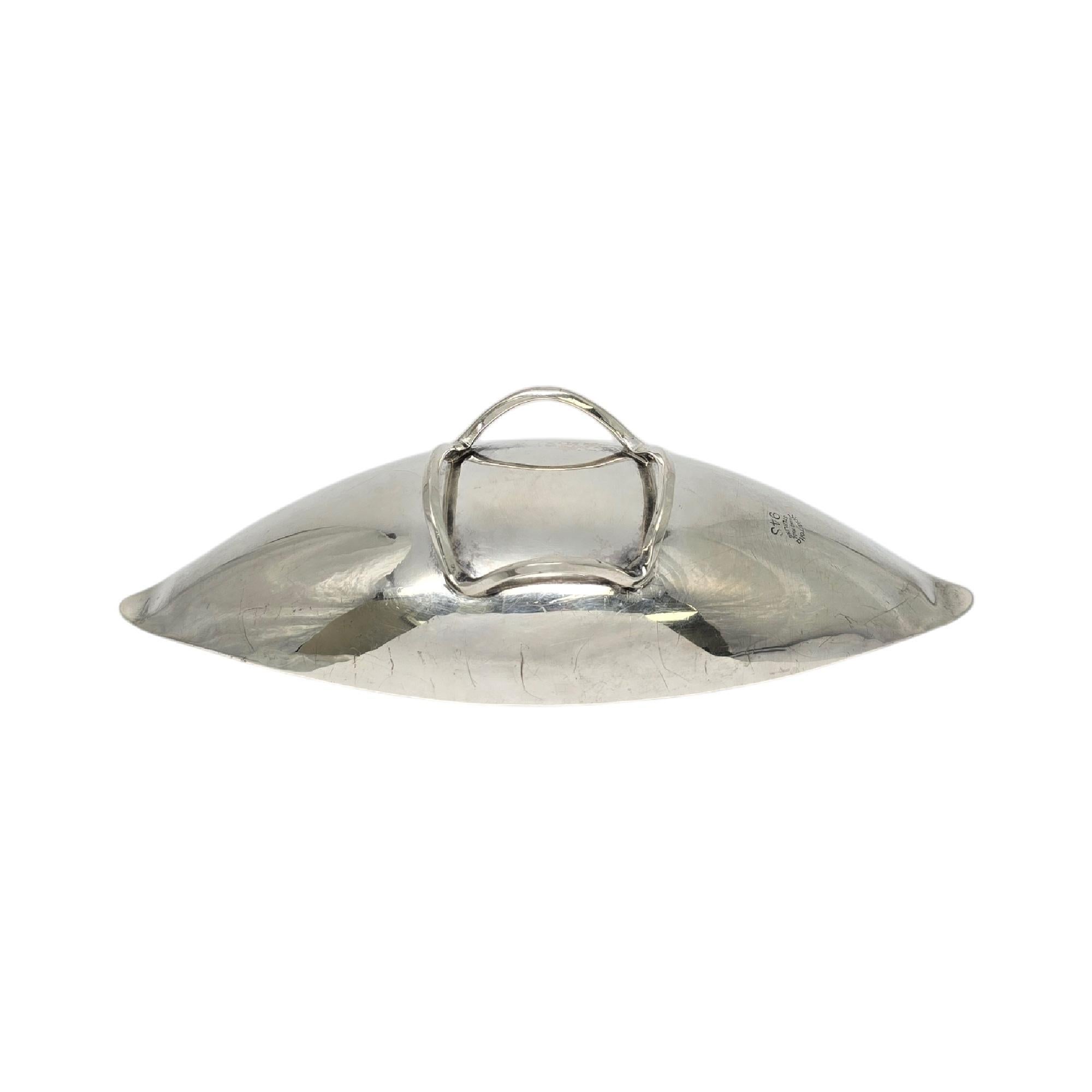 Vintage sterling silver oblong leaf footed bowl by Alfredo Sciarrotta, pattern #94S.

Alfredo Sciarrotta, known for high quality and superior craftsmanship, retailed his pieces at many high-end retailers in the mid-20th century. This piece is