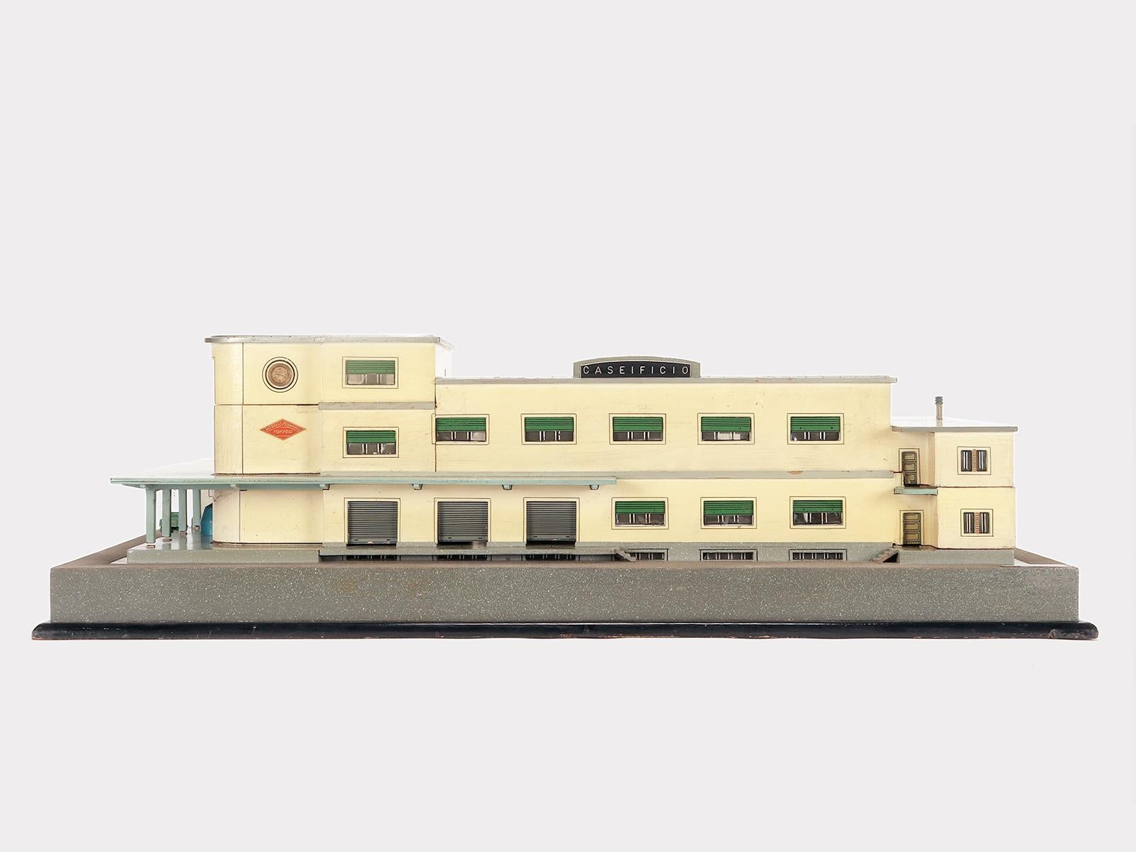 Miniature scientific model (Scale 1/100) for educational use, entirely handmade, in painted wood, depicting an architectural project of a dairy farm, external views and the laboratories inside. Original patina. V. Toffoli & Figli, scientific models