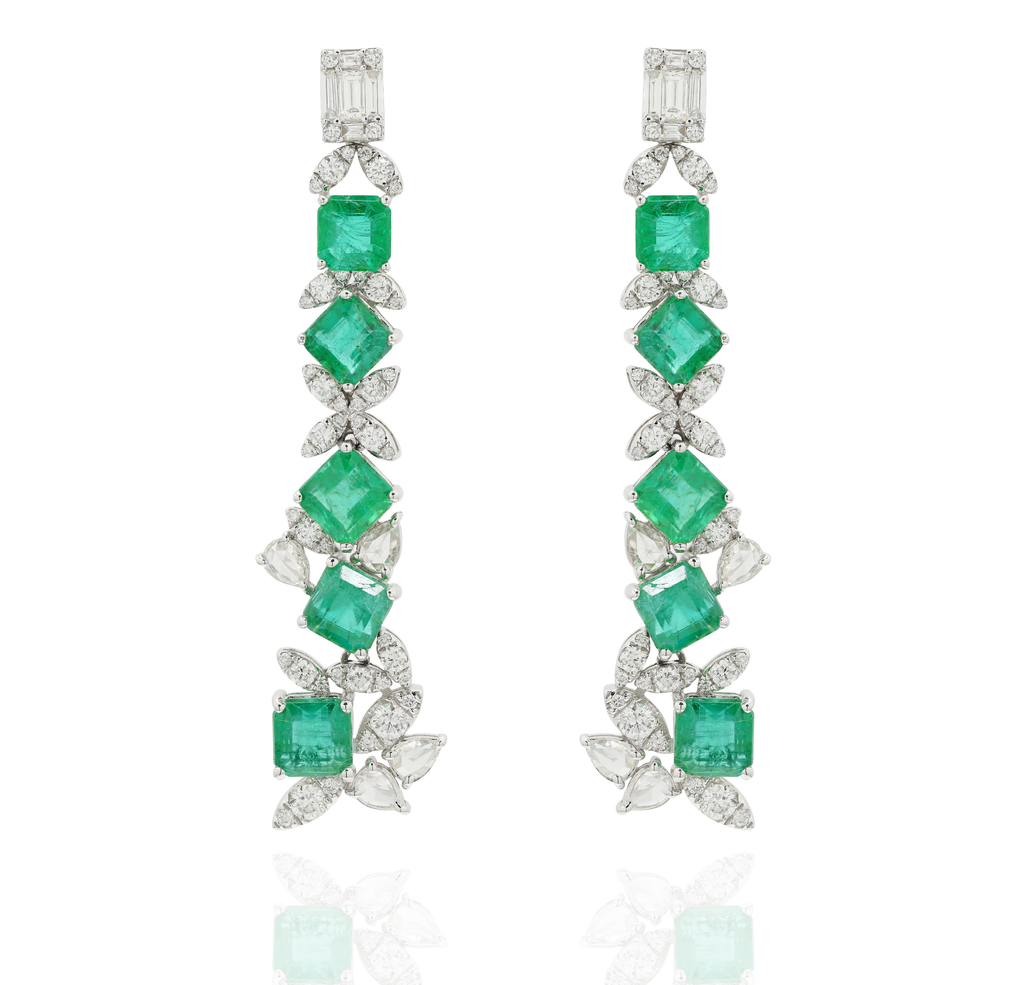 Designer Emerald and Diamond Long Dangle Earrings to make a statement with your look. These earrings create a sparkling, luxurious look featuring square cut gemstone.
If you love to gravitate towards unique styles, this piece of jewelry is perfect