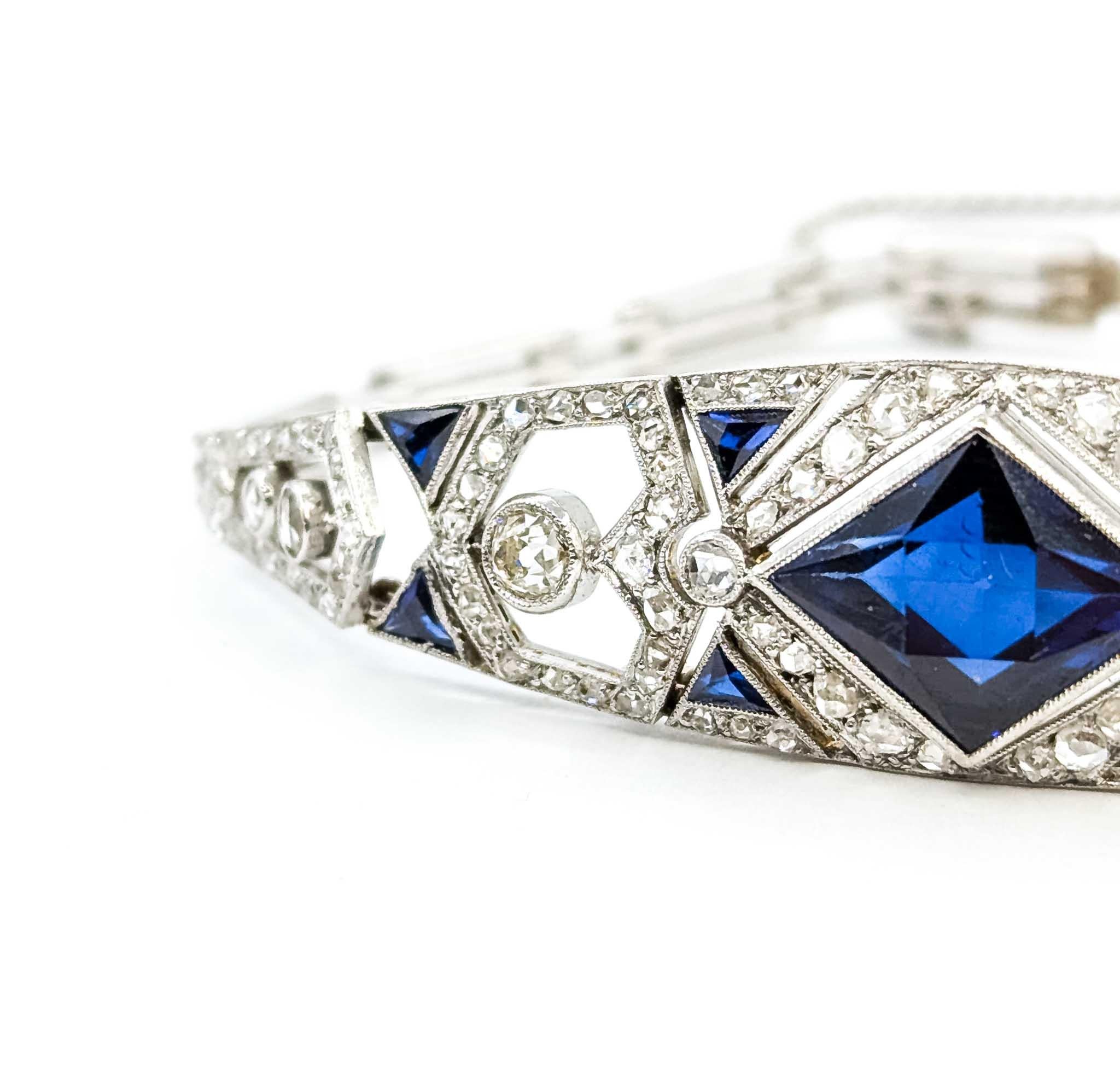 Scintillating Diamond and Synthetic Sapphire Bracelet Crafted in 14k White Gold Art Deco

Transcend the ordinary with our Scintillating Diamond and Synthetic Sapphire Bracelet crafted in 14k White Gold Art Deco. This exquisite piece is a testament
