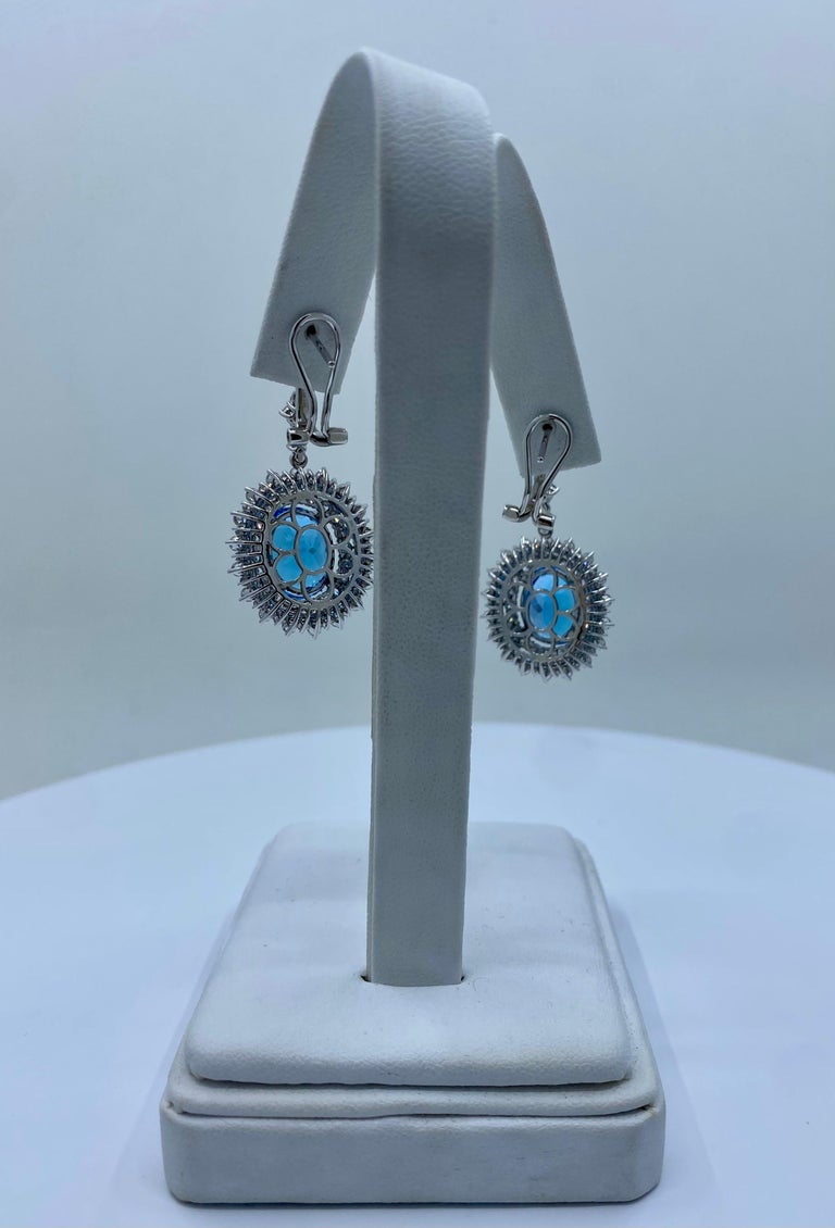 Oval Cut Scintillating Pair of 16.34 Carat Vivid Blue Topaz and Diamond 18K Gold Earrings For Sale