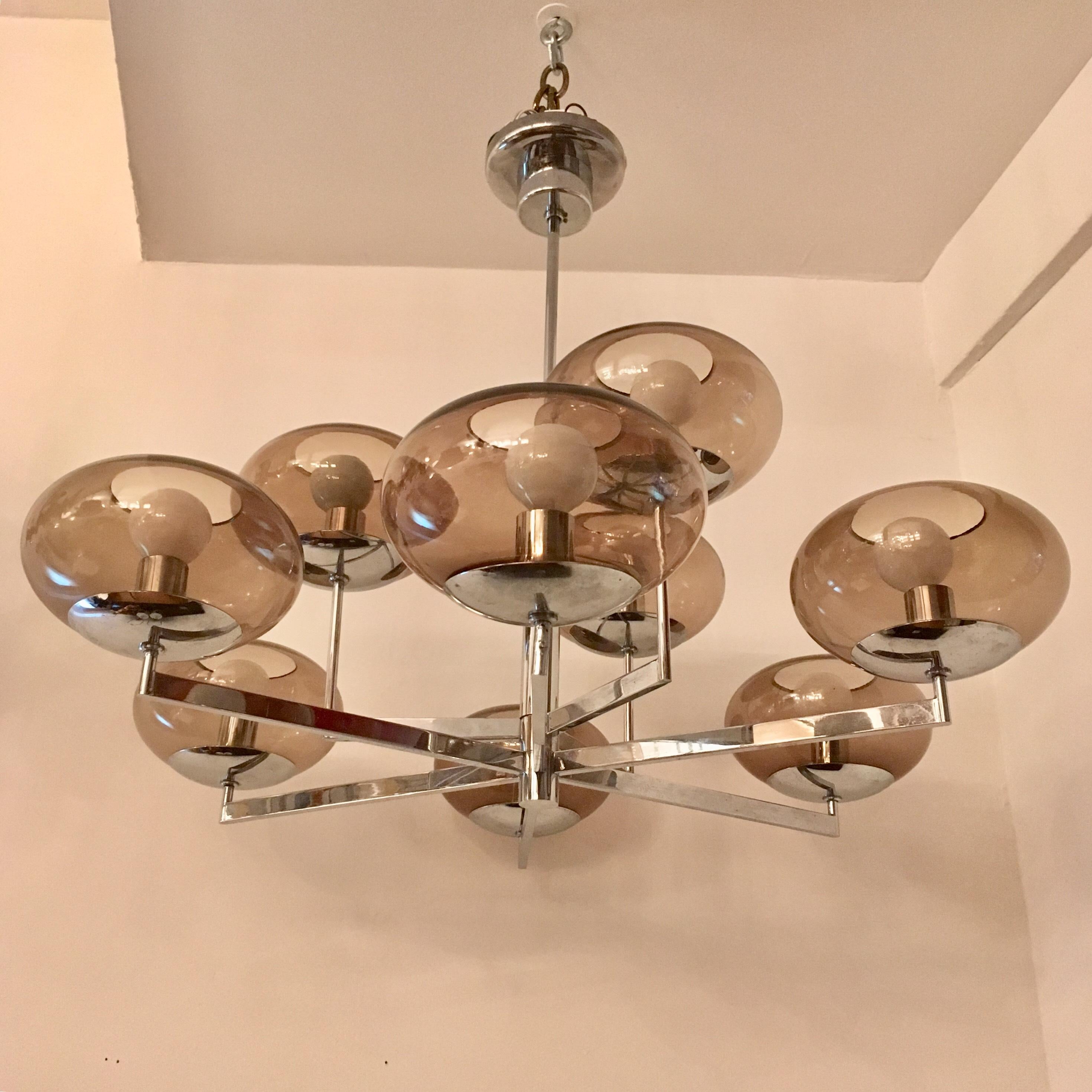 A sleek two-tier polished chrome and smoked glass globe chandelier by the famed Italian lighting company, Sciolari. Nine-light sources. Newly rewired.