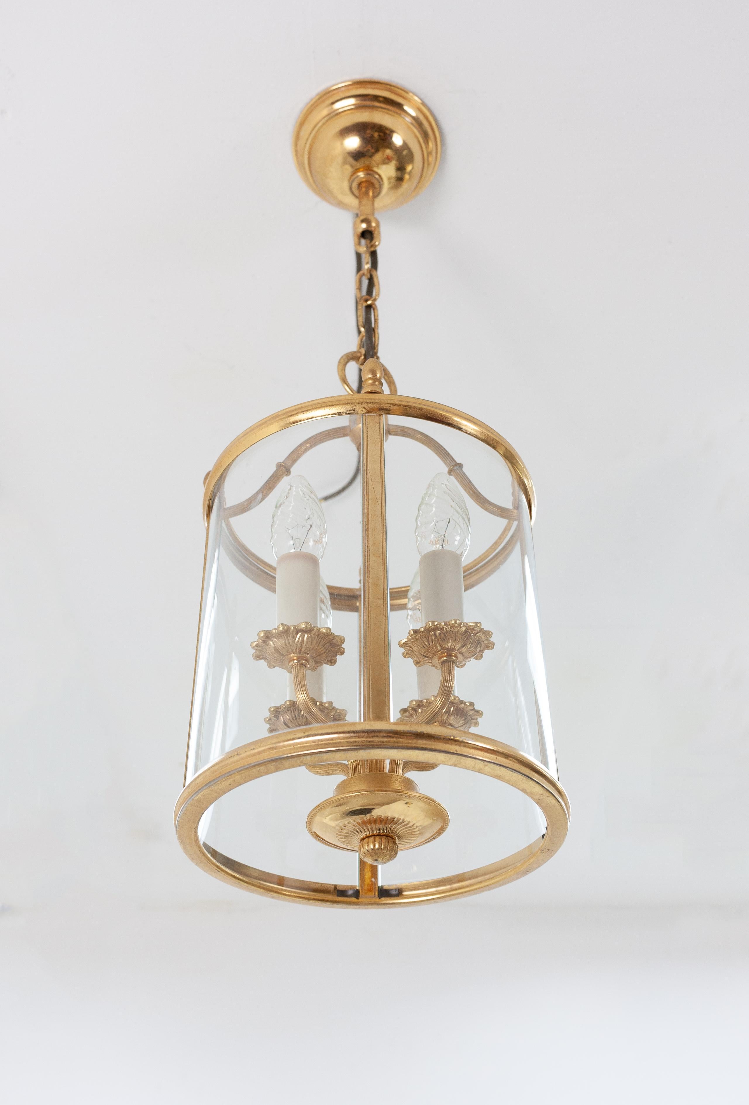 The ultimate Classic hall lamp, manufactured by Sciolari in Italy, 1970s. Featuring four armatures and a brass body with curved glass inserts. Great quality and signed on the inside of the canopy.
 