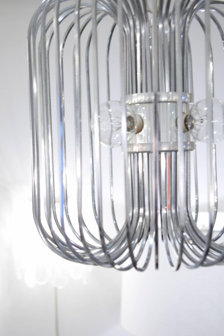 This chandelier designed by Sciolari is constructed out of chrome plated steel in the signature 