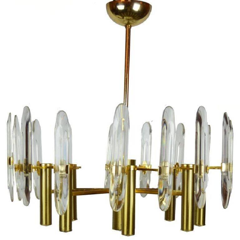 Gaetano Sciolari gold-plated eight-light chandelier with Glass prisms made in Italy in the 1970.
US rewired and in working condition. 60 watts max per bulb.
In good vintage condition.