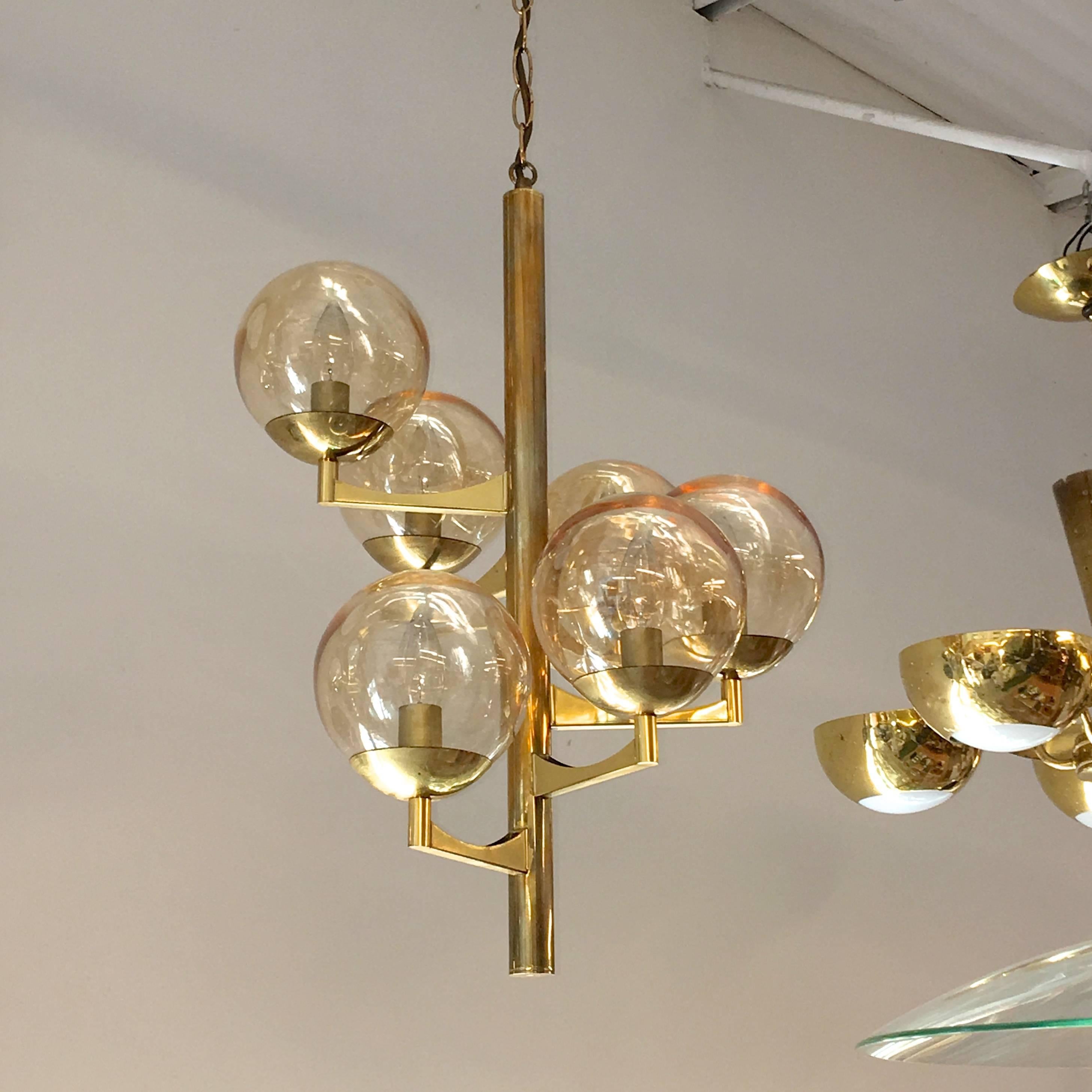 Gaetano Sciolari for Boulanger Belgium 1970s chandelier pendant with six amber glass balls on brass convex bobeches and brass supports arranged in a helix spiral around a central brass vertical stem suspended from brass chain.

Chain can be made