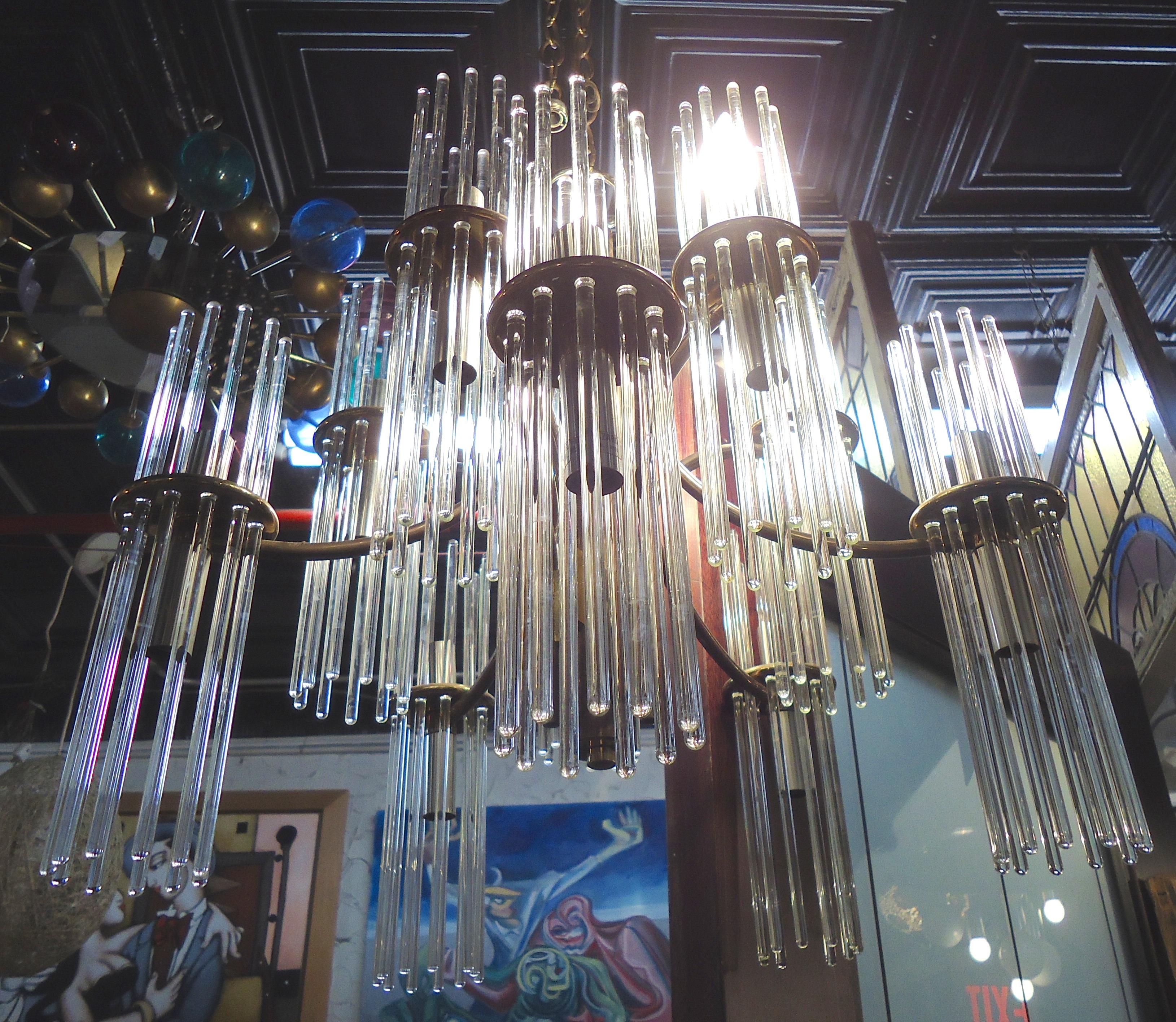 Gaetano Sciolari designed chandelier with up and down lighting behind glass rods. 

(Please confirm item location - NY or NJ - with dealer).
 