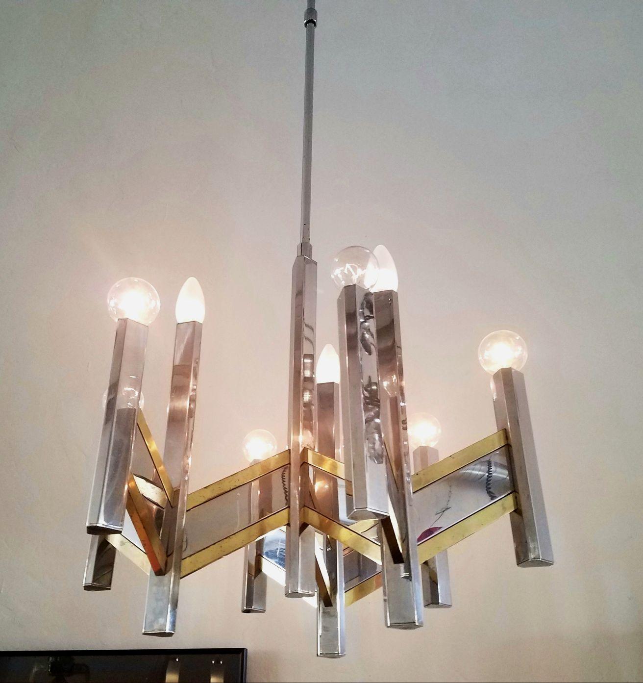 Italian midcentury chandelier by Sciolari. Chandelier have adjustable height second height is 36 inches. Combination of brass and chrome, 12 candelabra light.