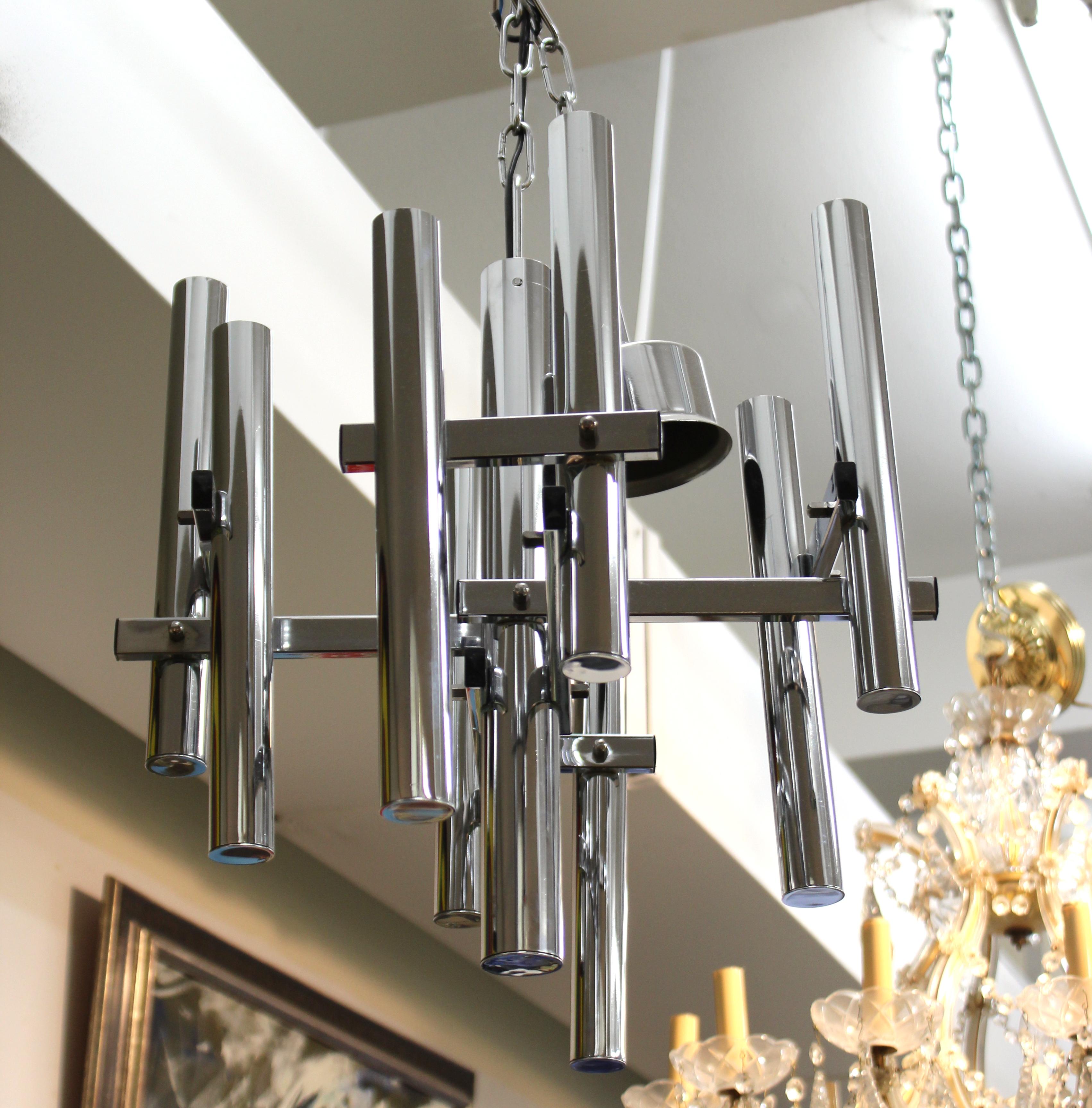 Italian modern chandelier pendant designed by Gaetano Sciolari in the 1970s. The piece is chromed and is in great vintage condition with some minor age-appropriate wear to the surfaces.