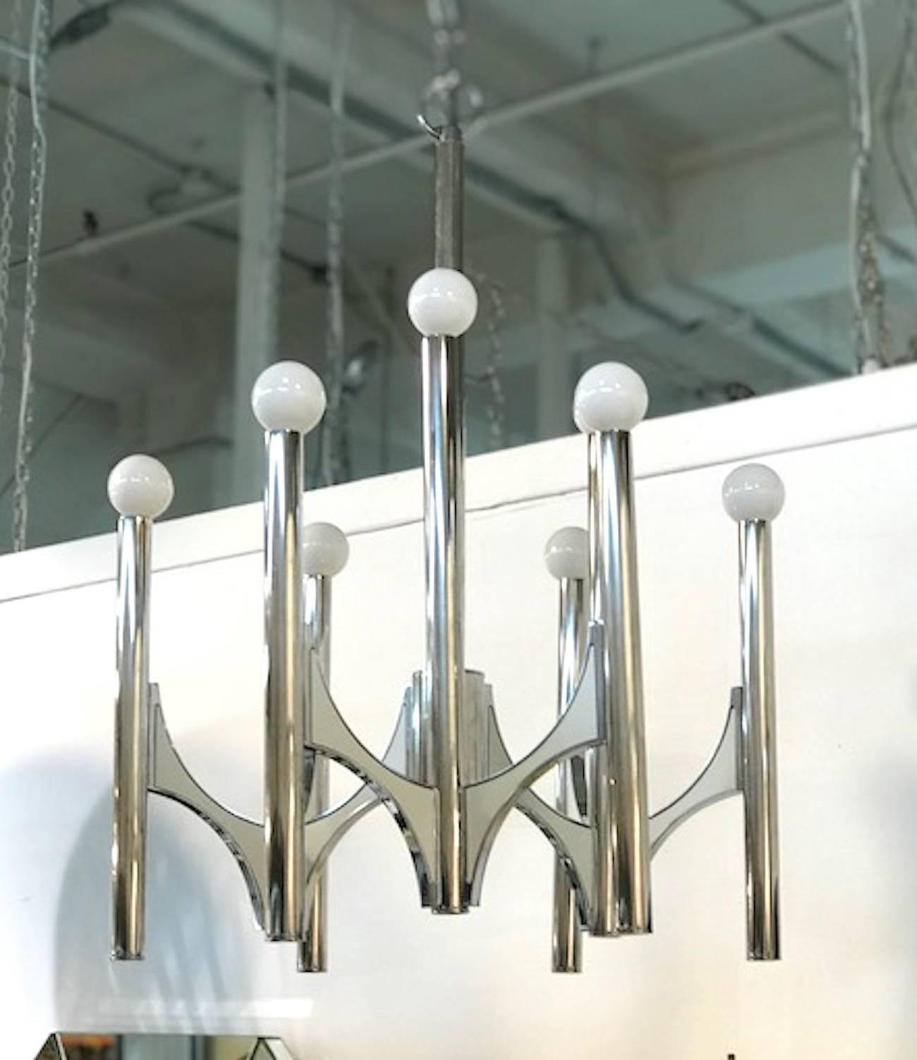 This chandelier is one of a group. There is a matching small three-light and large twelve-light version available (See last photo). It was produced by the long time lighting manufacturer Sciolari of Italy, circa 1960-1970. The family company opened