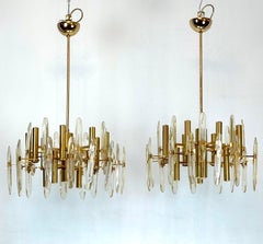 Sciolari, pair of Italian brass and glass chandeliers from 70s