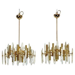 Sciolari, pair of Italian brass and glass chandeliers from 70s