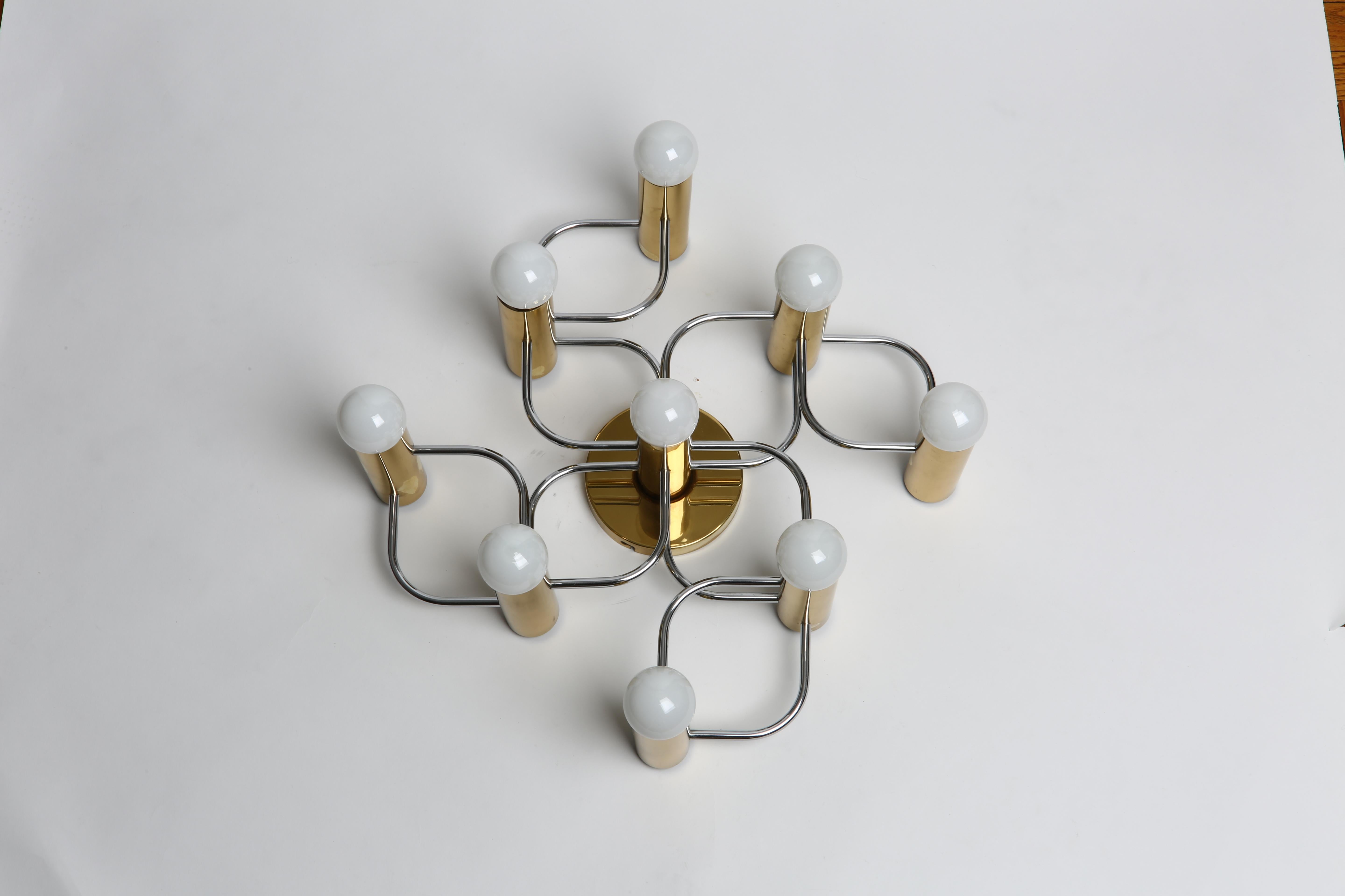 Sciolari style flush mount with nine lights.
Made with solid polished brass and chrome-plated metal.
Can be used as ceiling or wall light.
  