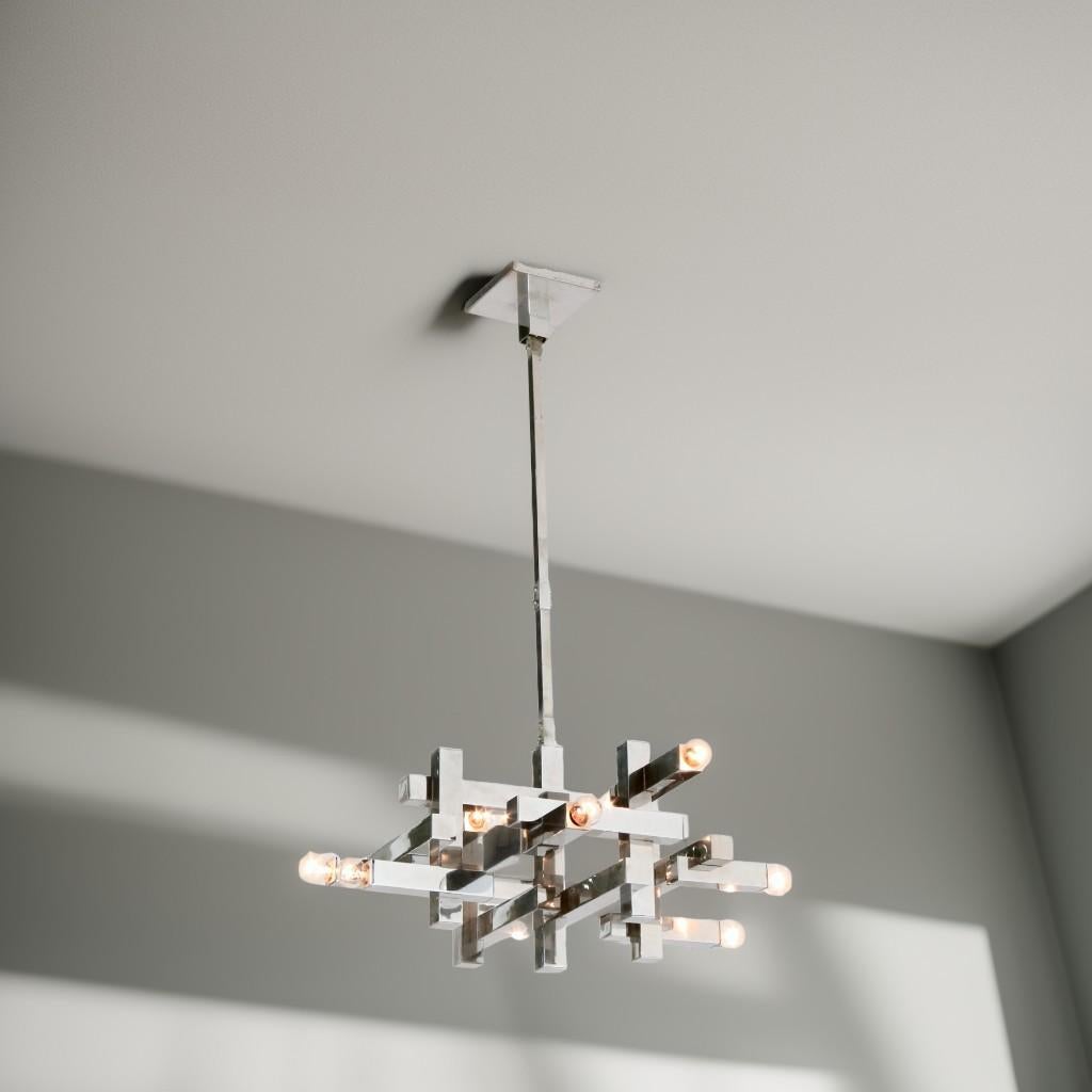 This chrome-plated  suspension lamp with brass structure by Sciolari, originating from the 1970s, epitomizes timeless elegance of Italian Design. Its sleek design, characterized by clean lines and a geometric aesthetic, crystallises the fusion of