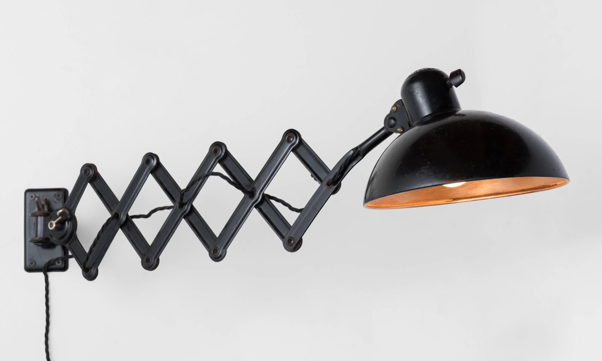 Scissor Lamp by Kaiser Idell, Germany, circa 1940

Model 6718 extendable lamp in original black paint. 

Lamp extends 16